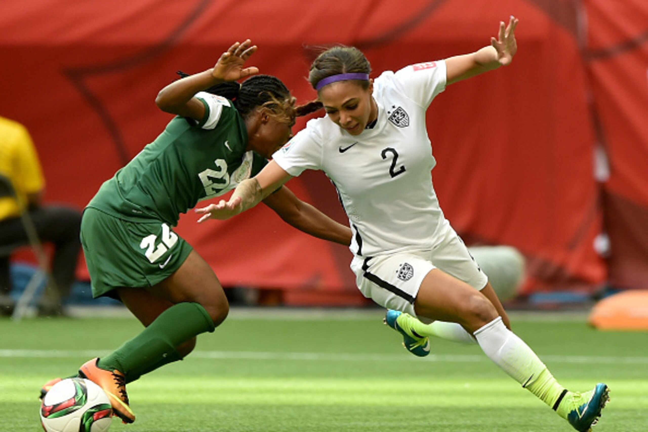 VANCOUVER, BC - JUNE 16:  Sydney Leroux #2 of the United States is taken down by Sarah Nnodim #22 of Nigeria as Nnodim is given a red card in the second half in the Group D match of the FIFA Women's World Cup Canada 2015 at BC Place Stadium on June 16, 20