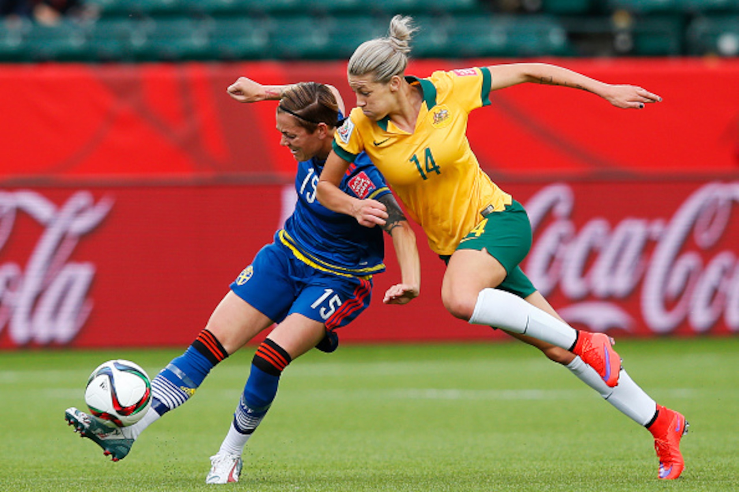 EDMONTON, AB - JUNE 16: Amanda Ilestedt #14 of Australia and Teresa Polias #15 of Sweden race for the ball during the FIFA Women's World Cup Canada Group D match between Australia and Sweden at Commonwealth Stadium on June 16, 2015 in Edmonton, Alberta, C