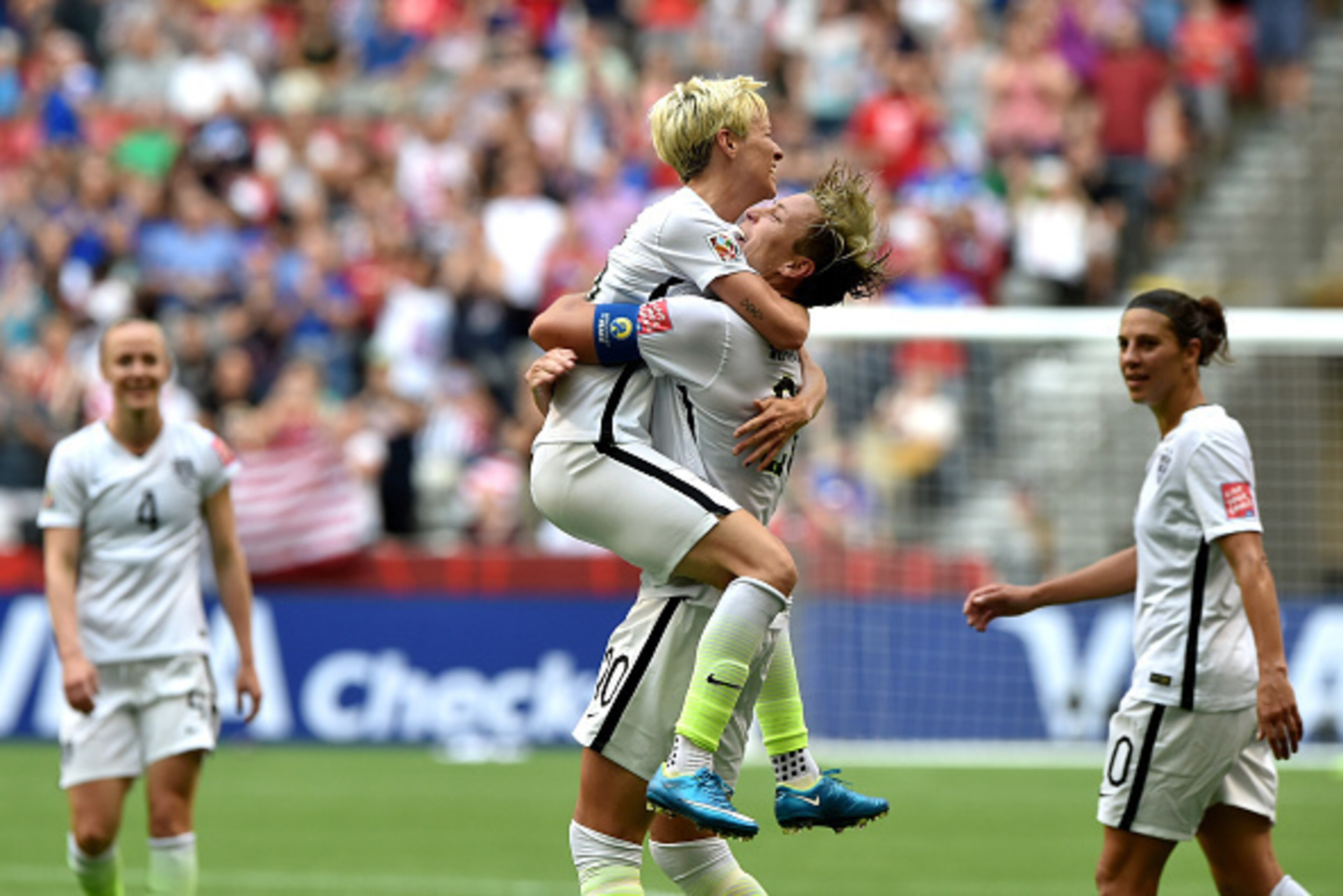 VANCOUVER, BC - JUNE 16:  Abby Wambach #20 of the United States celebrates with Megan Rapinoe #15 after Wambach scores a goal in the first half against Nigeria in the Group D match of the FIFA Women's World Cup Canada 2015 at BC Place Stadium on June 16, 