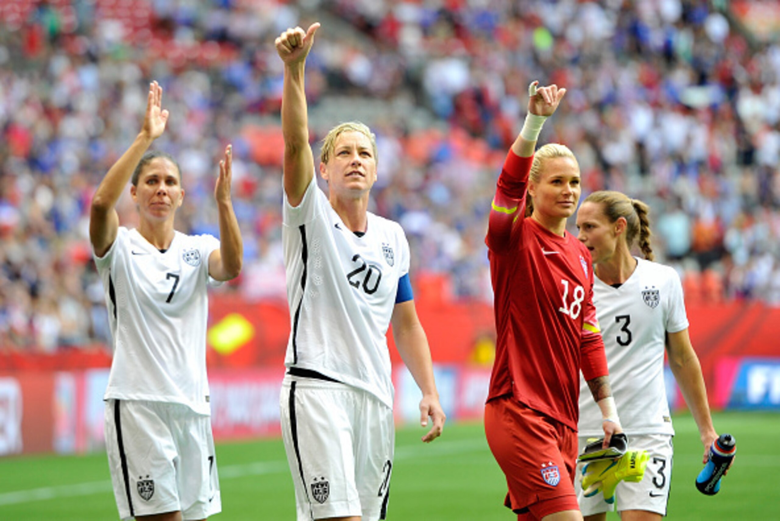 VANCOUVER, BC - JUNE 16:  Shannon Boxx #7, Abby Wambach #20, Ashlyn Harris #18, and Christie Rampone #3 of the United States celebrate with teammates after the 1-0 victory against Nigeria in the Group D match of the FIFA Women's World Cup Canada 2015 at B