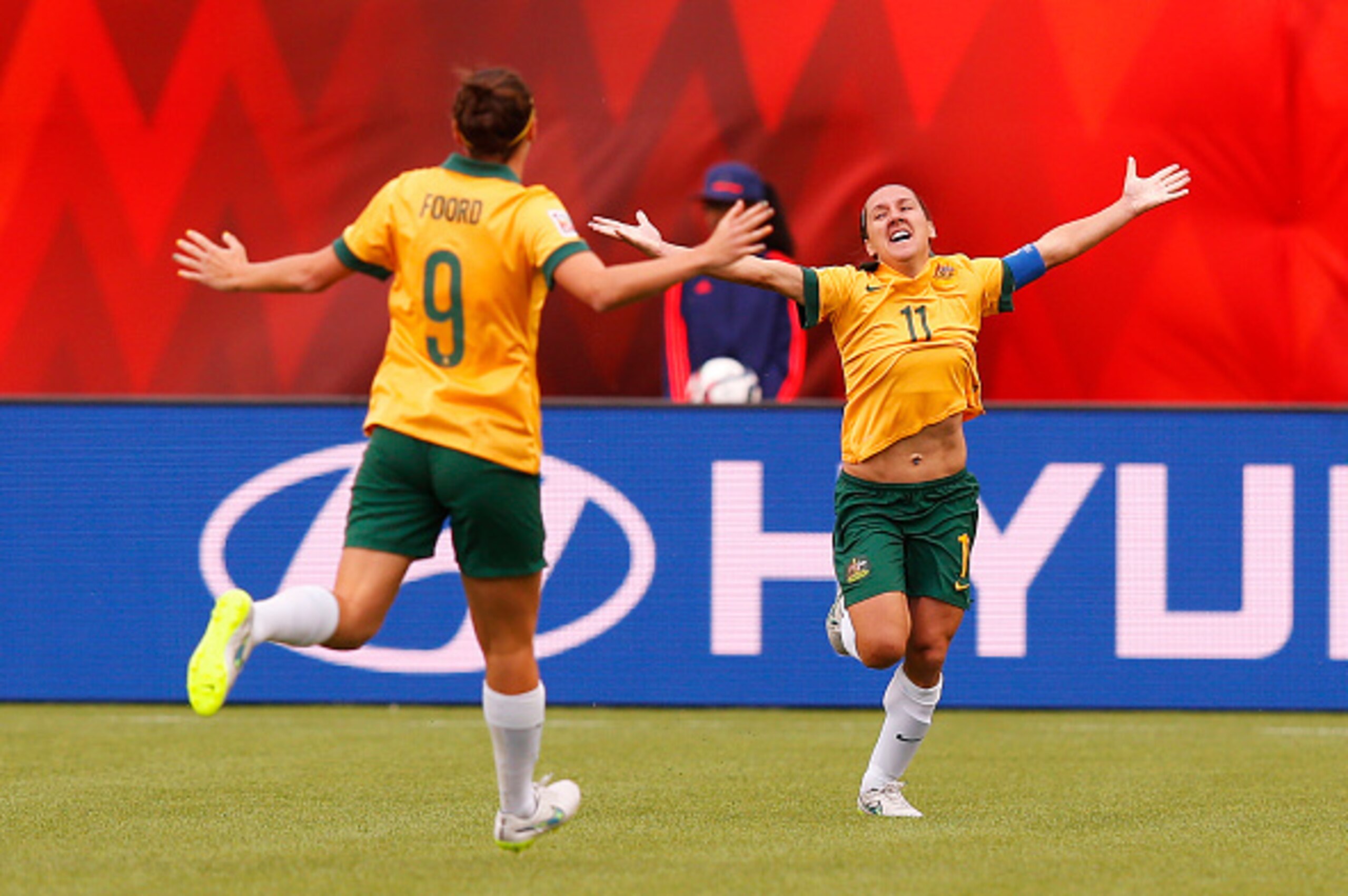 EDMONTON, AB - JUNE 16: Lisa De Vanna #11 celebrates her goal with teammate Caitlin Foord #9 of Australia during the FIFA Women's World Cup Canada Group D match between Australia and Sweden at Commonwealth Stadium on June 16, 2015 in Edmonton, Alberta, Ca