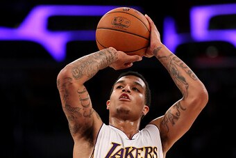 LOS ANGELES, CA - APRIL 12:  Jabari Brown #15 of the Los Angeles Lakers shoots a foul shot against the Dallas Mavericks at Staples Center on April 12, 2015 in Los Angeles, California.  The Mavericks won 120-106. NOTE TO USER: User expressly acknowledges a