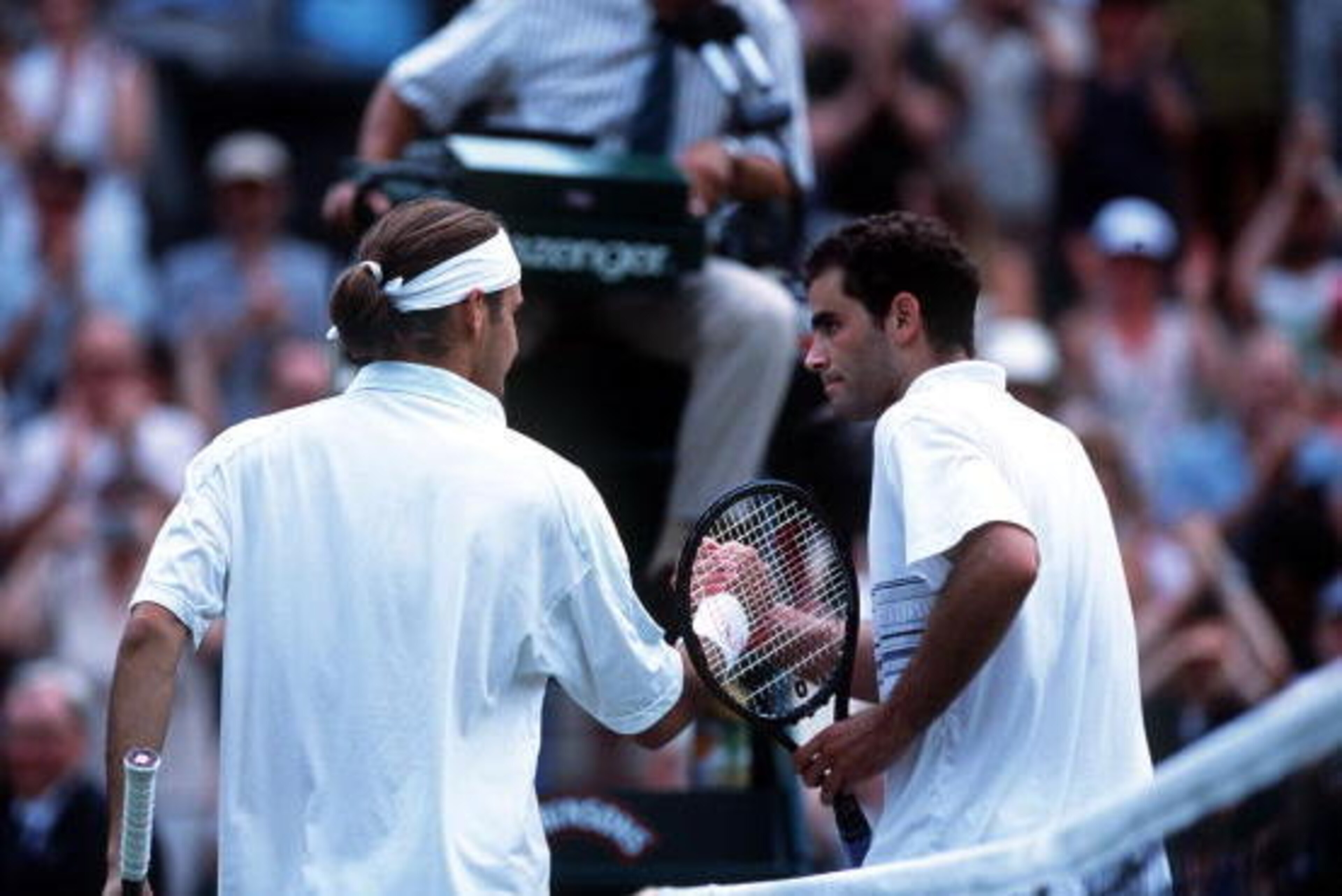 2 Jul 2001:  Pete Sampras of the USA congratulates Roger Federer of Switzerland following his victory during the men's fourth round of The All England Lawn Tennis Championship at Wimbledon, London.  Mandatory Credit: Clive Brunskill/ALLSPORT