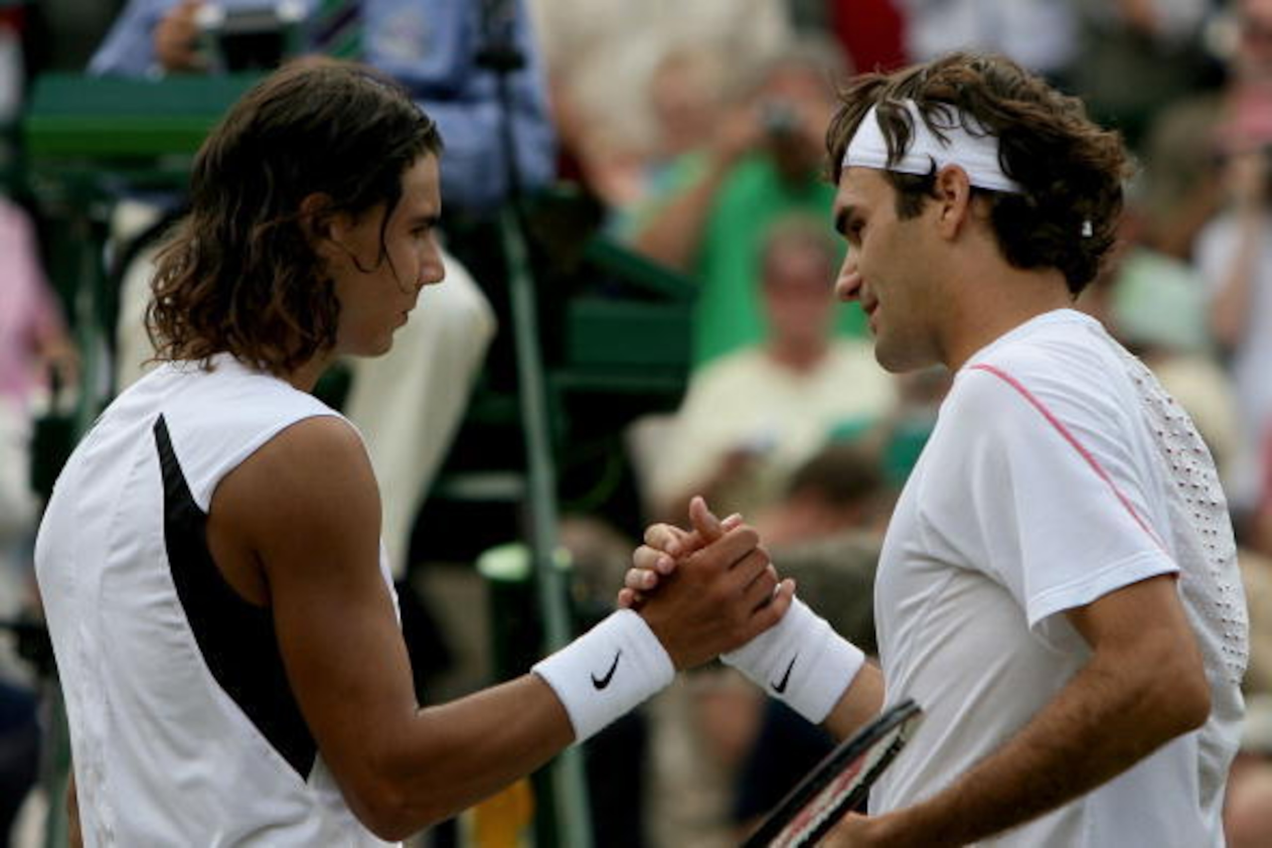 LONDON - JULY 09: Roger Federer (R) of Switzerland shakes hands with Rafael Nadal of Spain after winning the men's final on day thirteen of the Wimbledon Lawn Tennis Championships at the All England Lawn Tennis and Croquet Club on July 9, 2006 in London, LONDON - JULY 09: Roger Federer (R) of Switzerland shakes hands with Rafael Nadal of Spain after winning the men's final on day thirteen of the Wimbledon Lawn Tennis Championships at the All England Lawn Tennis and Croquet Club on July 9, 2006 in London,
