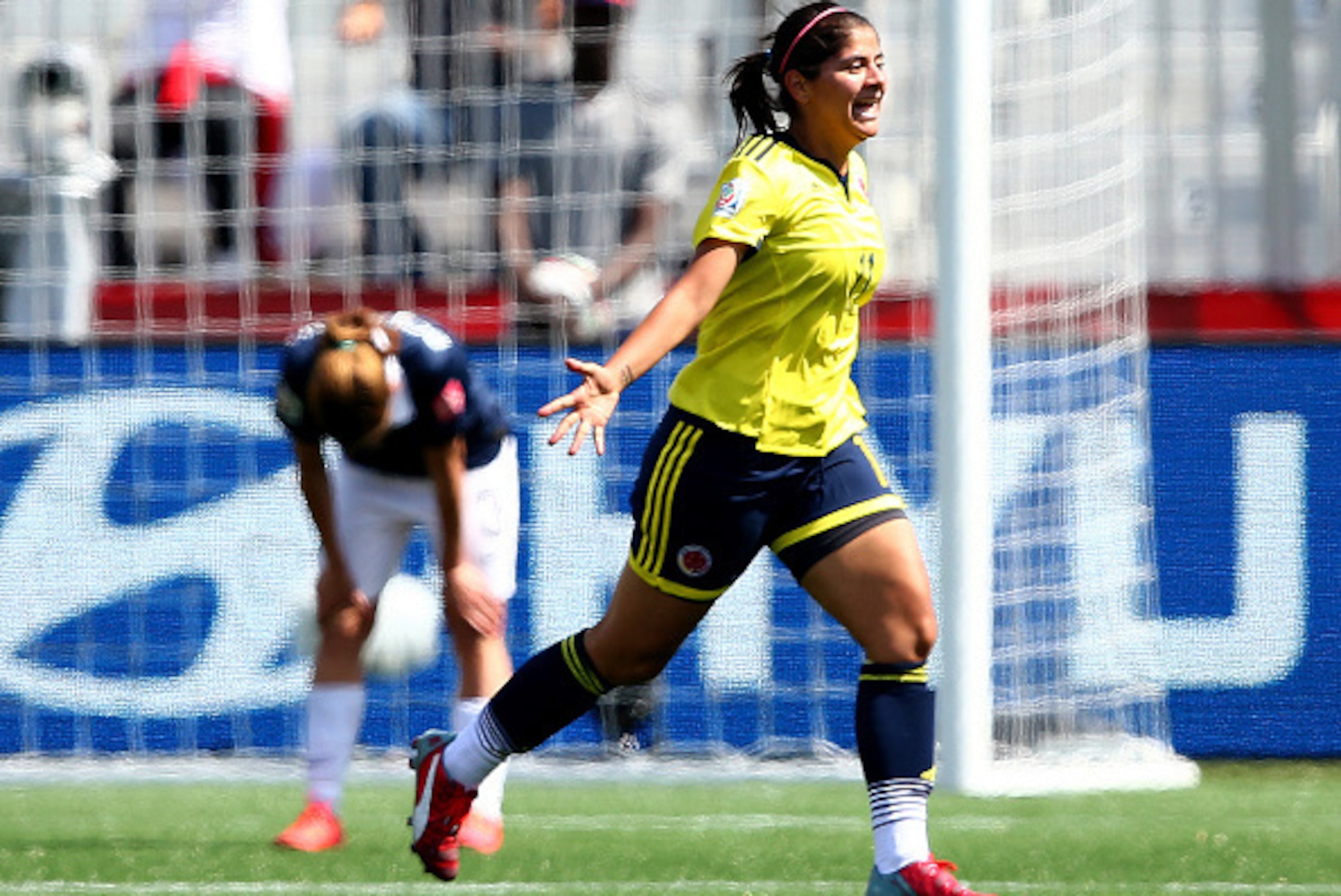 MONCTON, NB - JUNE 13:  Catalina Usme #11 of Colombia celebrates her goal in the second half against France during the FIFA Women's World Cup 2015 Group F match at Moncton Stadium on June 13, 2015 in Moncton, Canada.  (Photo by Elsa/Getty Images)