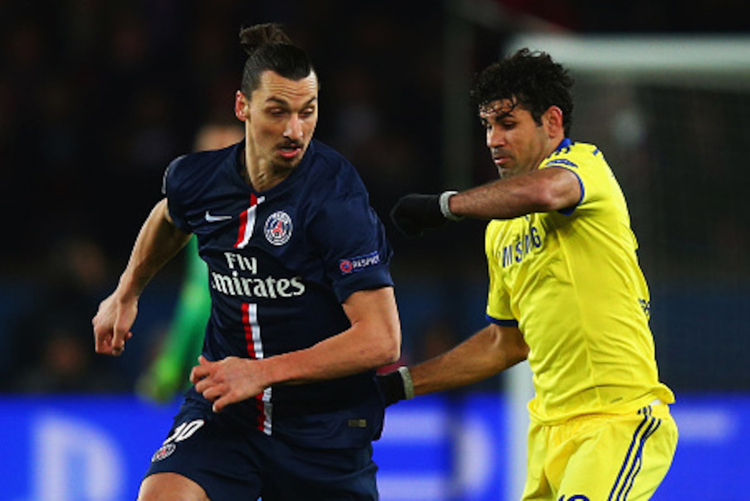 PARIS, FRANCE - FEBRUARY 17:  Zlatan Ibrahimovic of Paris Saint-Germain evades Diego Costa of Chelsea during the UEFA Champions League Round of 16 match between Paris Saint-Germain and Chelsea at Parc des Princes on February 17, 2015 in Paris, France.  (P