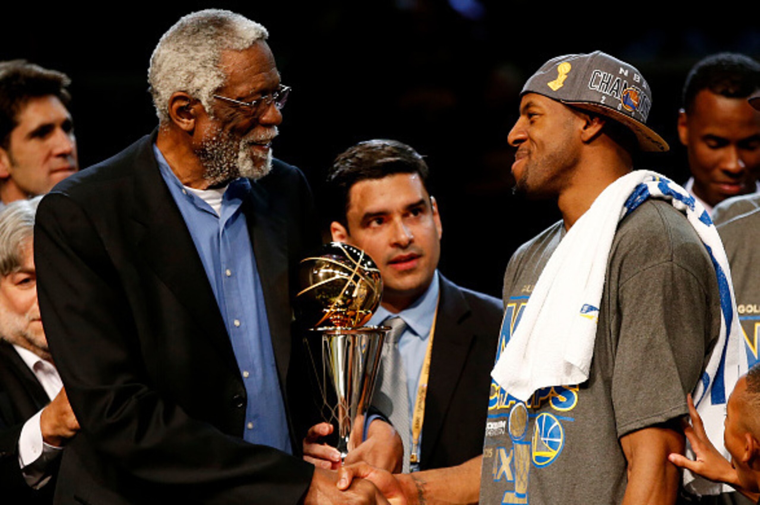 CLEVELAND, OH - JUNE 16:  Bill Russell and Andre Iguodala #9 of the Golden State Warriors shake hands after he receives the 2015 NBA Finals MVP award following their win over the Cleveland Cavaliers in Game Six of the 2015 NBA Finals at Quicken Loans Aren