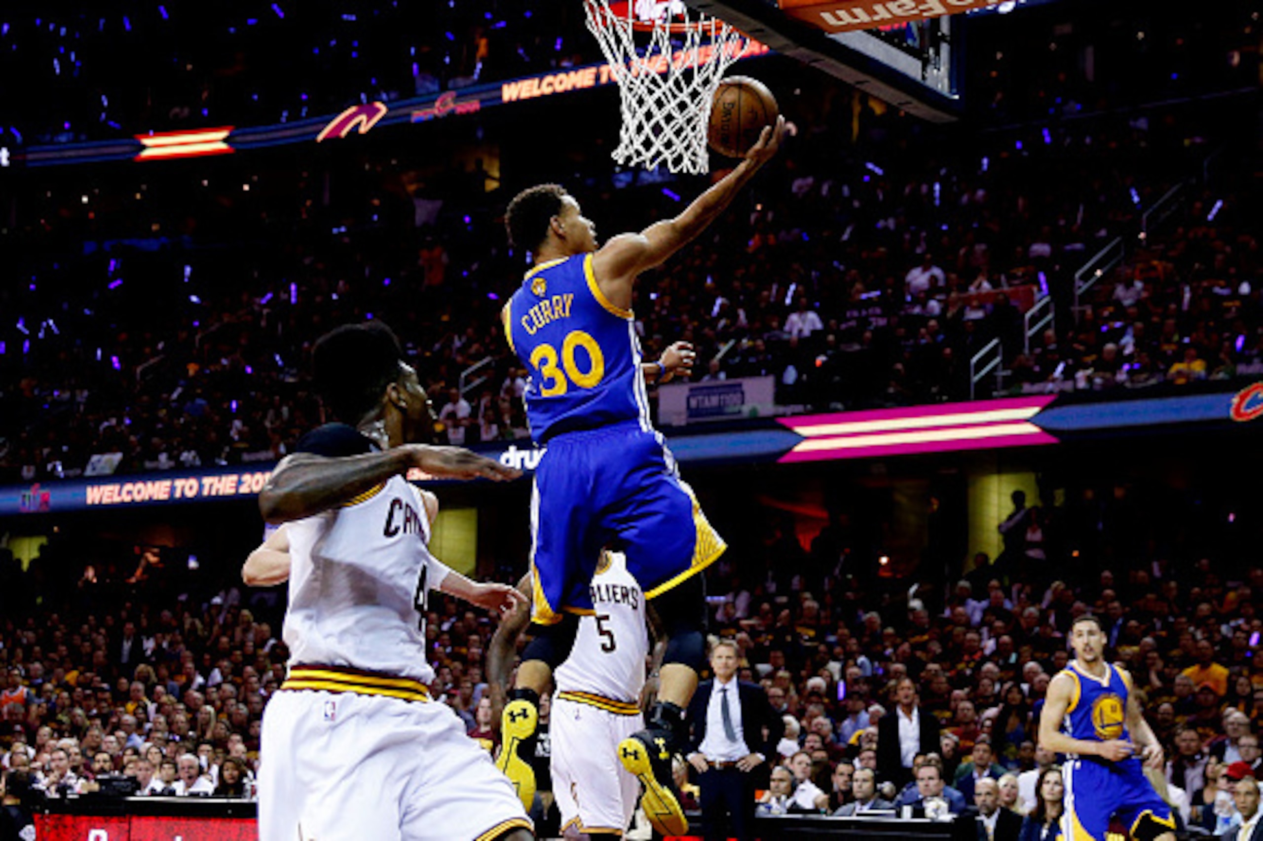 CLEVELAND, OH - JUNE 16:  Stephen Curry #30 of the Golden State Warriors goes up against the Cleveland Cavaliers in the first quarter during Game Six of the 2015 NBA Finals at Quicken Loans Arena on June 16, 2015 in Cleveland, Ohio. NOTE TO USER: User exp