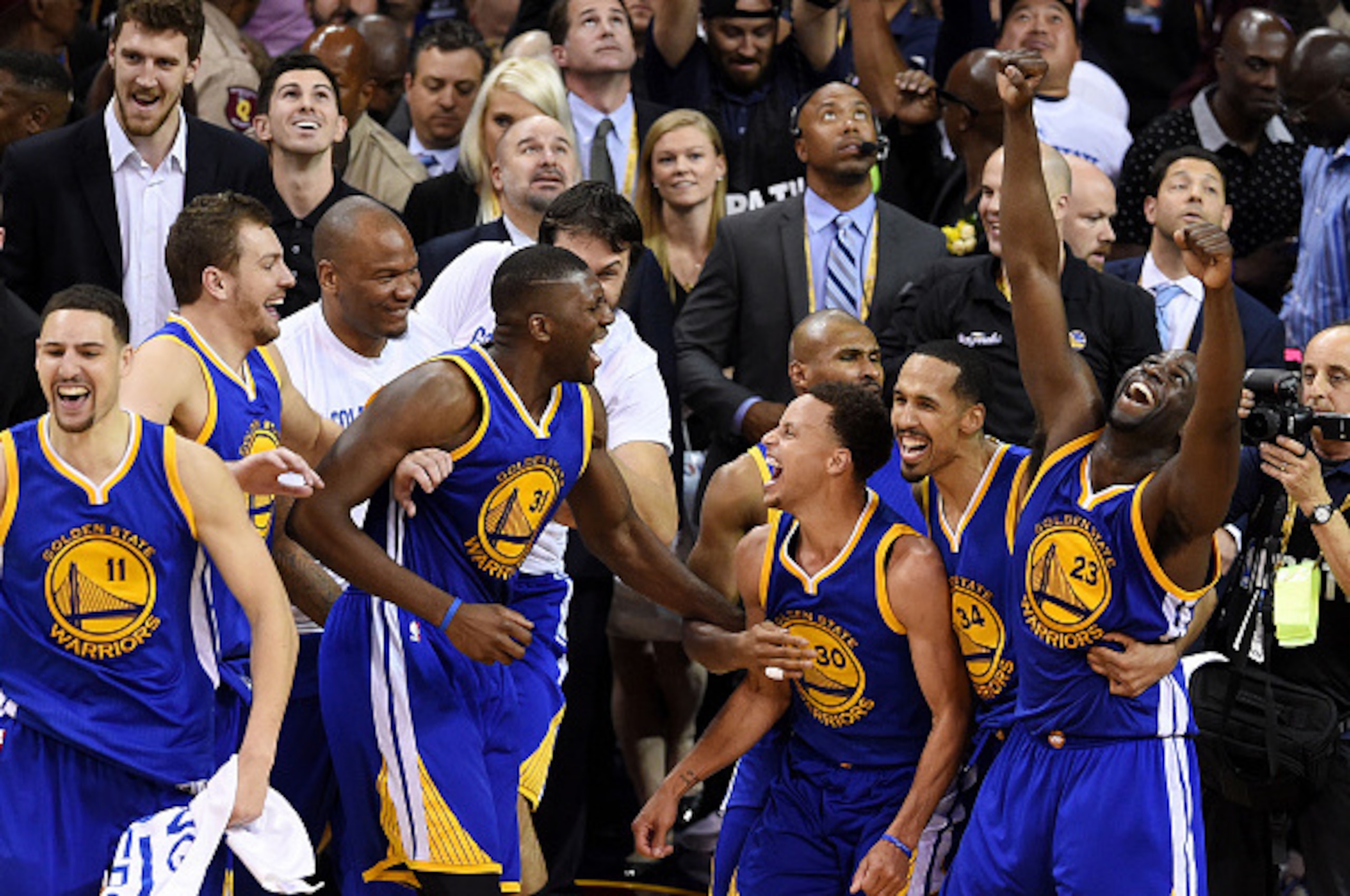 CLEVELAND, OH - JUNE 16:  Stephen Curry #30 and the Golden State Warriors celebrate their 105 to 97 win over the Cleveland Cavaliers in Game Six of the 2015 NBA Finals at Quicken Loans Arena on June 16, 2015 in Cleveland, Ohio. NOTE TO USER: User expressl
