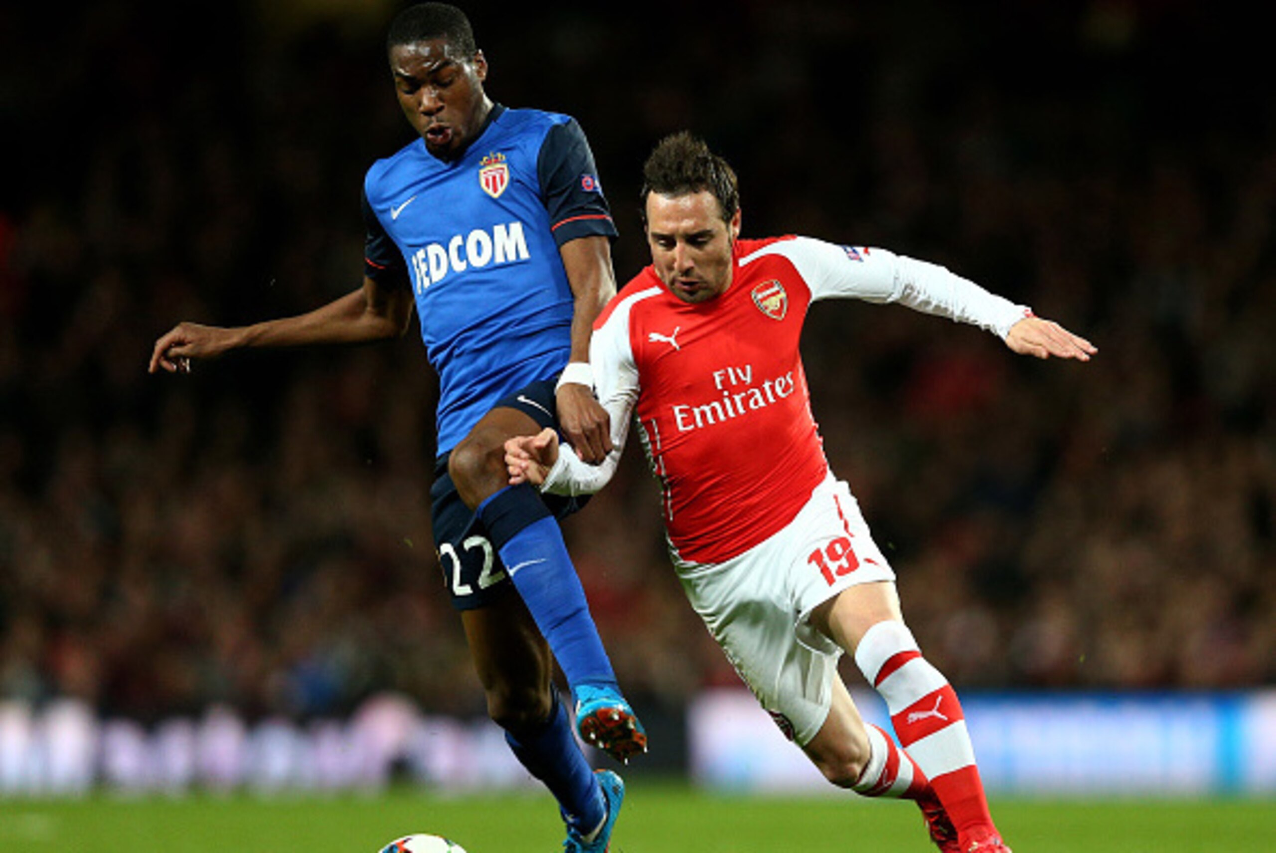 LONDON, ENGLAND - FEBRUARY 25: Geoffrey Kondogbia of Monaco and Santi Cazorla of Arsenal battle for the ball during the UEFA Champions League round of 16, first leg match between Arsenal and Monaco at The Emirates Stadium on February 25, 2015 in London, LONDON, ENGLAND - FEBRUARY 25: Geoffrey Kondogbia of Monaco and Santi Cazorla of Arsenal battle for the ball during the UEFA Champions League round of 16, first leg match between Arsenal and Monaco at The Emirates Stadium on February 25, 2015 in London,