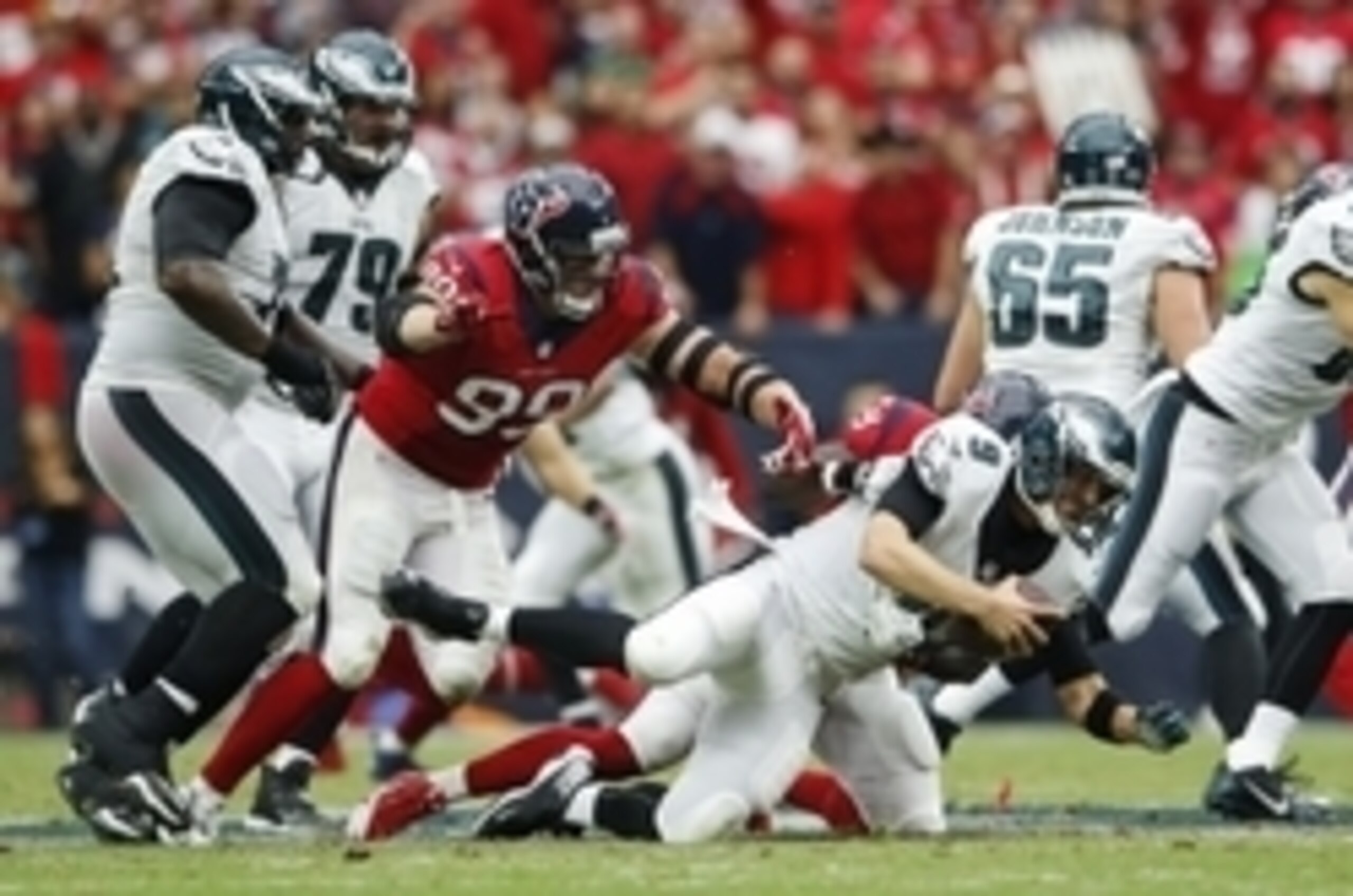 Nov 2, 2014; Houston, TX, USA; Philadelphia Eagles quarterback Nick Foles (9) is pressured by Houston Texans defensive end J.J. Watt (99) during the game at NRG Stadium. Mandatory Credit: Kevin Jairaj-USA TODAY Sports