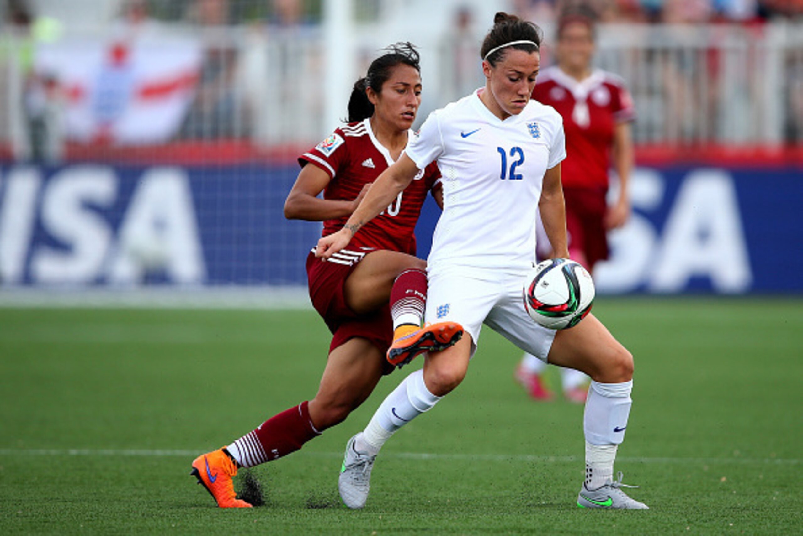 MONCTON, NB - JUNE 13:  Lucy Bronze #12 of England and Stephany Mayor #10 of Mexico fight for the ball in the first half during the FIFA Women's World Cup 2015 Group F match at Moncton Stadium on June 13, 2015 in Moncton, Canada.  (Photo by Elsa/Getty Ima