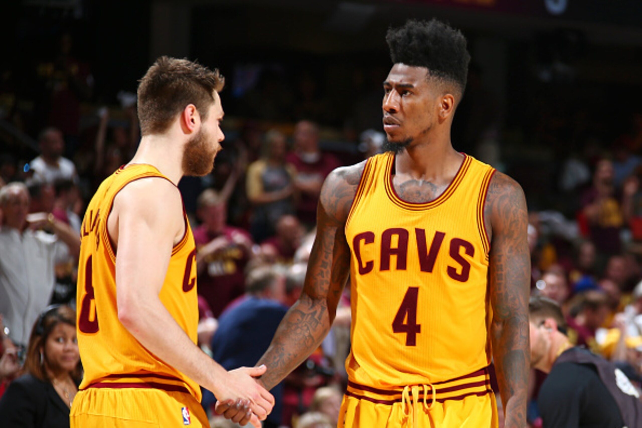 CLEVELAND, OH - JUNE 11:  Teammates Matthew Dellavedova #8 of the Cleveland Cavaliers and Iman Shumpert #4 of the Cleveland Cavaliers high-five during Game Four of the 2015 NBA Finals at The Quicken Loans Arena on June 11, 2015 in Cleveland, Ohio. NOTE TO