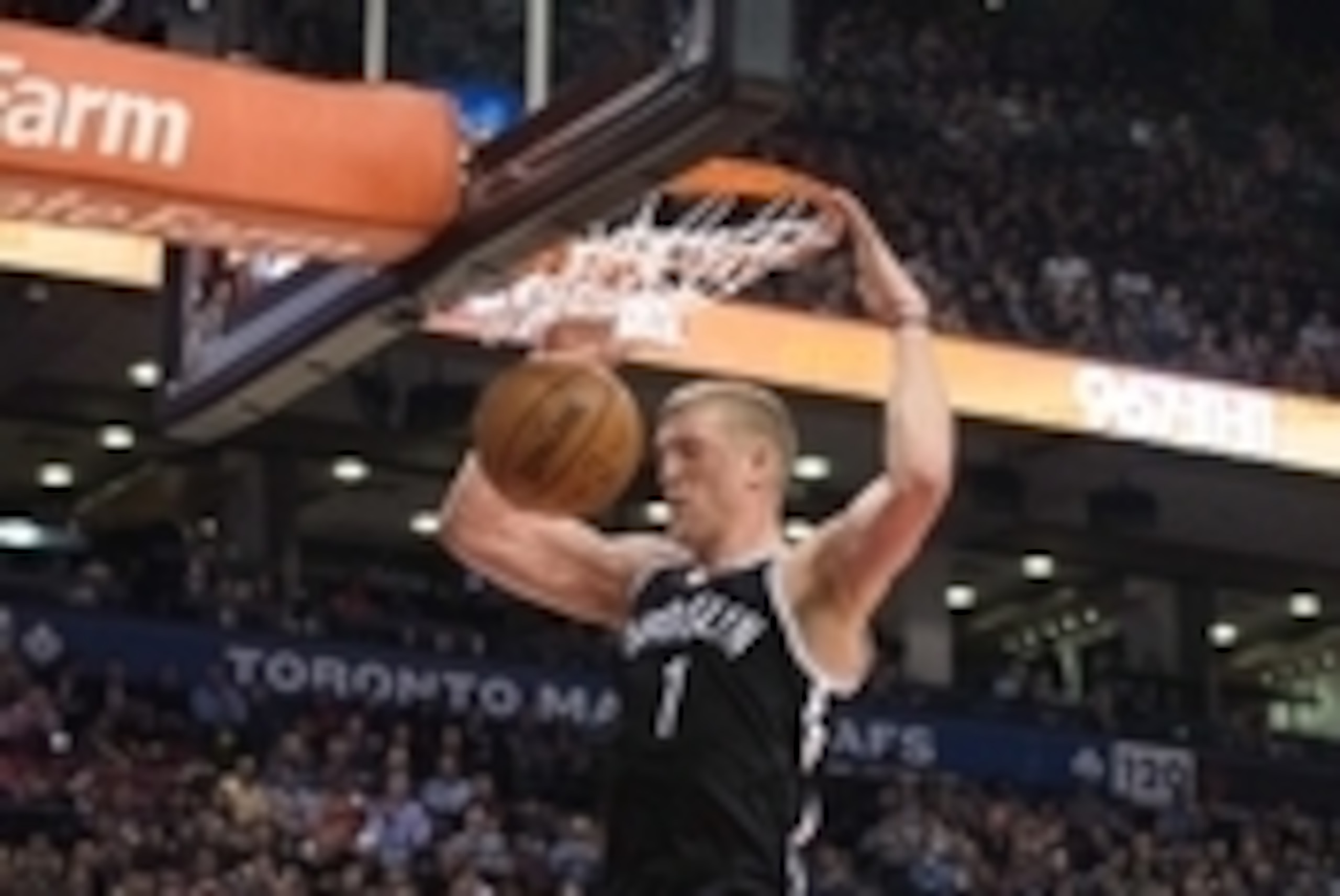Feb 4, 2015; Toronto, Ontario, CAN; Brooklyn Nets center Mason Plumlee (1) scores a basket during the third quarter in a game against the Toronto Raptors at Air Canada Centre. The Brooklyn Nets won 109-93. Mandatory Credit: Nick Turchiaro-USA TODAY Sports