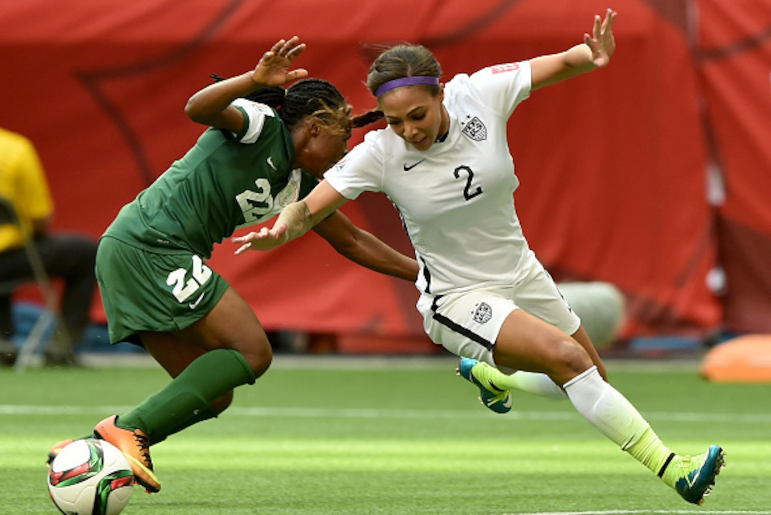 VANCOUVER, BC - JUNE 16:  Sydney Leroux #2 of the United States is taken down by Sarah Nnodim #22 of Nigeria as Nnodim is given a red card in the second half in the Group D match of the FIFA Women's World Cup Canada 2015 at BC Place Stadium on June 16, 20