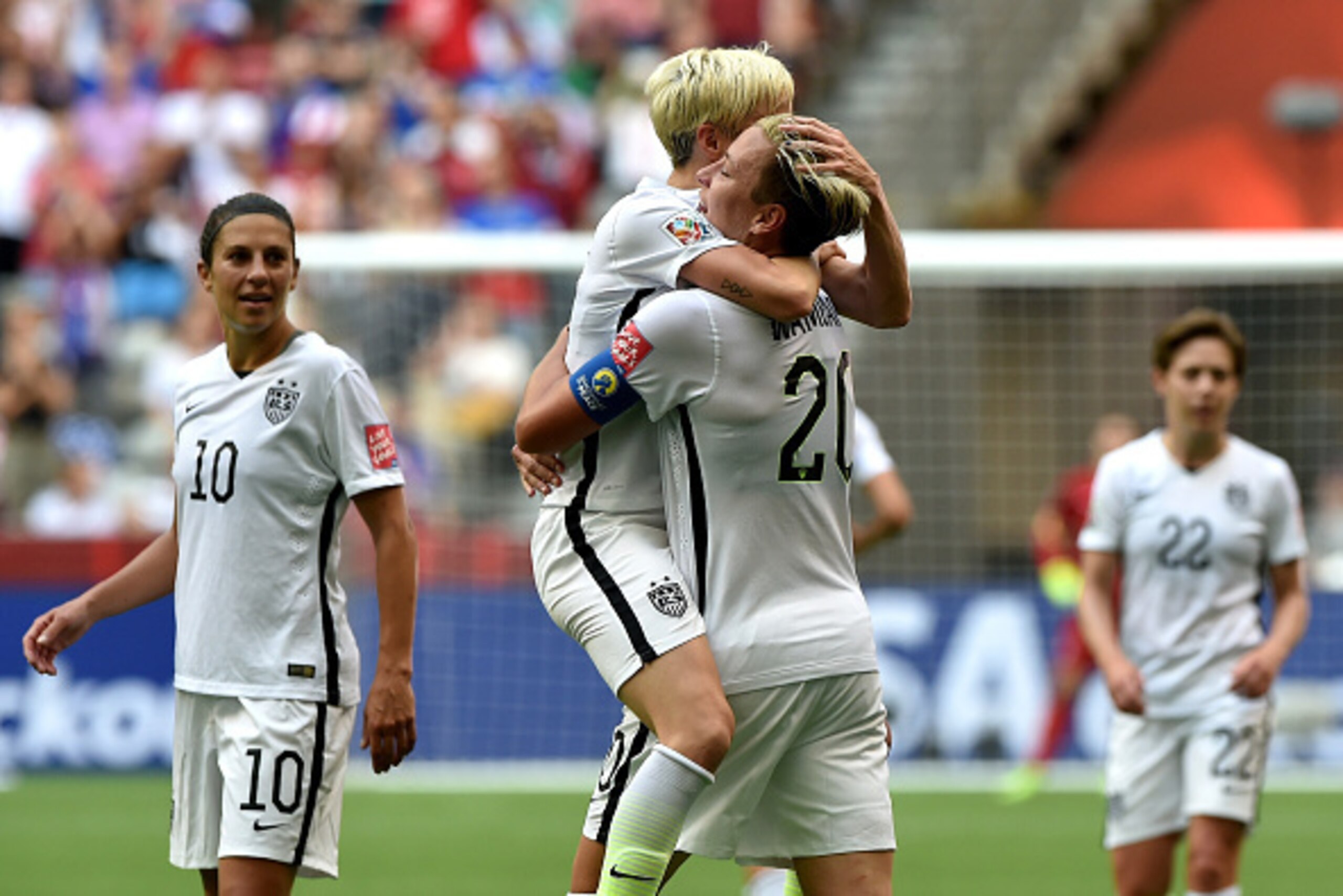 VANCOUVER, BC - JUNE 16:  Abby Wambach #20 of the United States celebrates with Megan Rapinoe #15 after Wambach scores a goal in the first half against Nigeria in the Group D match of the FIFA Women's World Cup Canada 2015 at BC Place Stadium on June 16, 