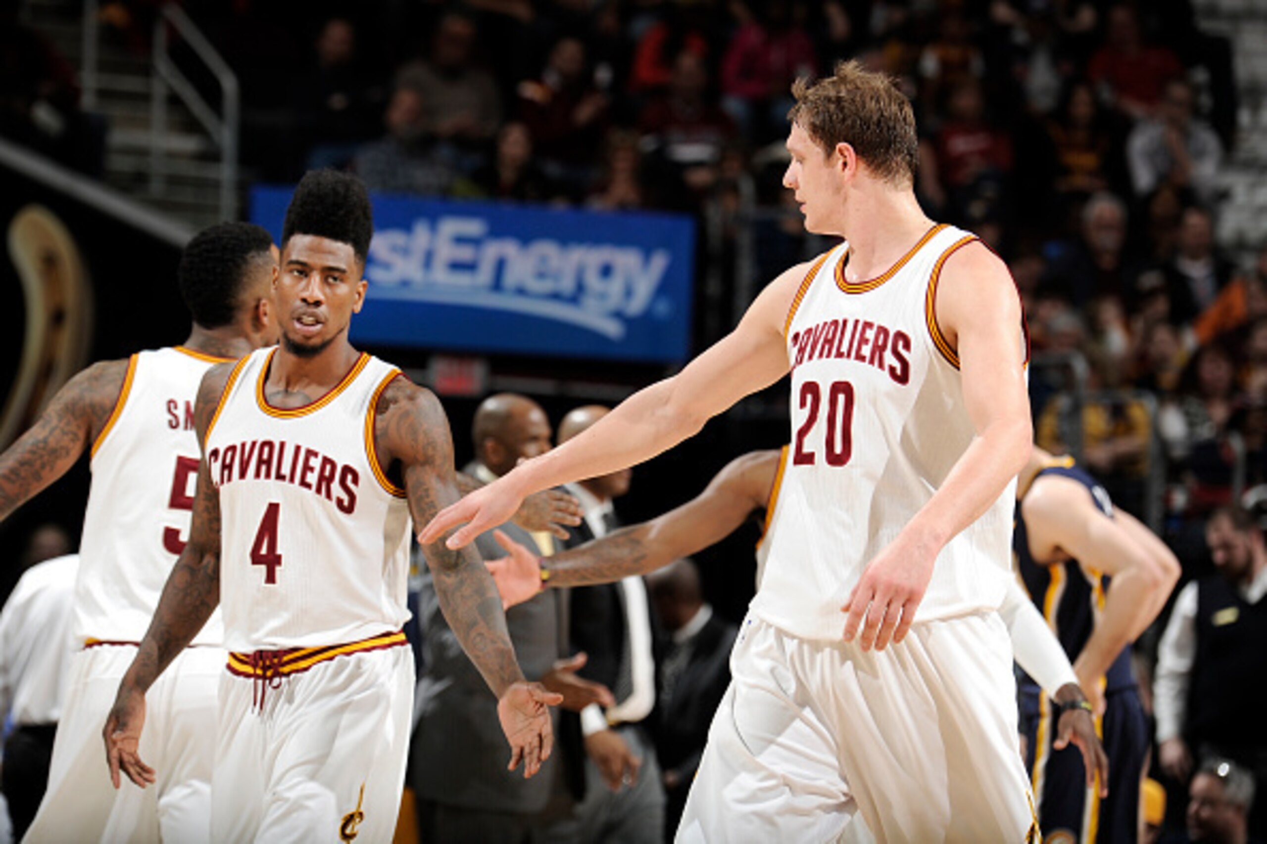CLEVELAND, OH - MARCH 20: Iman Shumpert #4 high fives Timofey Mozgov #20 of the Cleveland Cavaliers during the game against the Indiana Pacers on March 20, 2015 at Quicken Loans Arena in Cleveland, Ohio. NOTE TO USER: User expressly acknowledges and agree