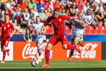 PRAGUE, CZECH REPUBLIC - JUNE 17:  Pavel Kaderabek (L) of Czech Republic battles for the ball with Rasmus Falk (R) of Denmark during UEFA U21 European Championship Group A match between Czech Republic and Denmark at Eden Stadium on June 17, 2015 in Prague