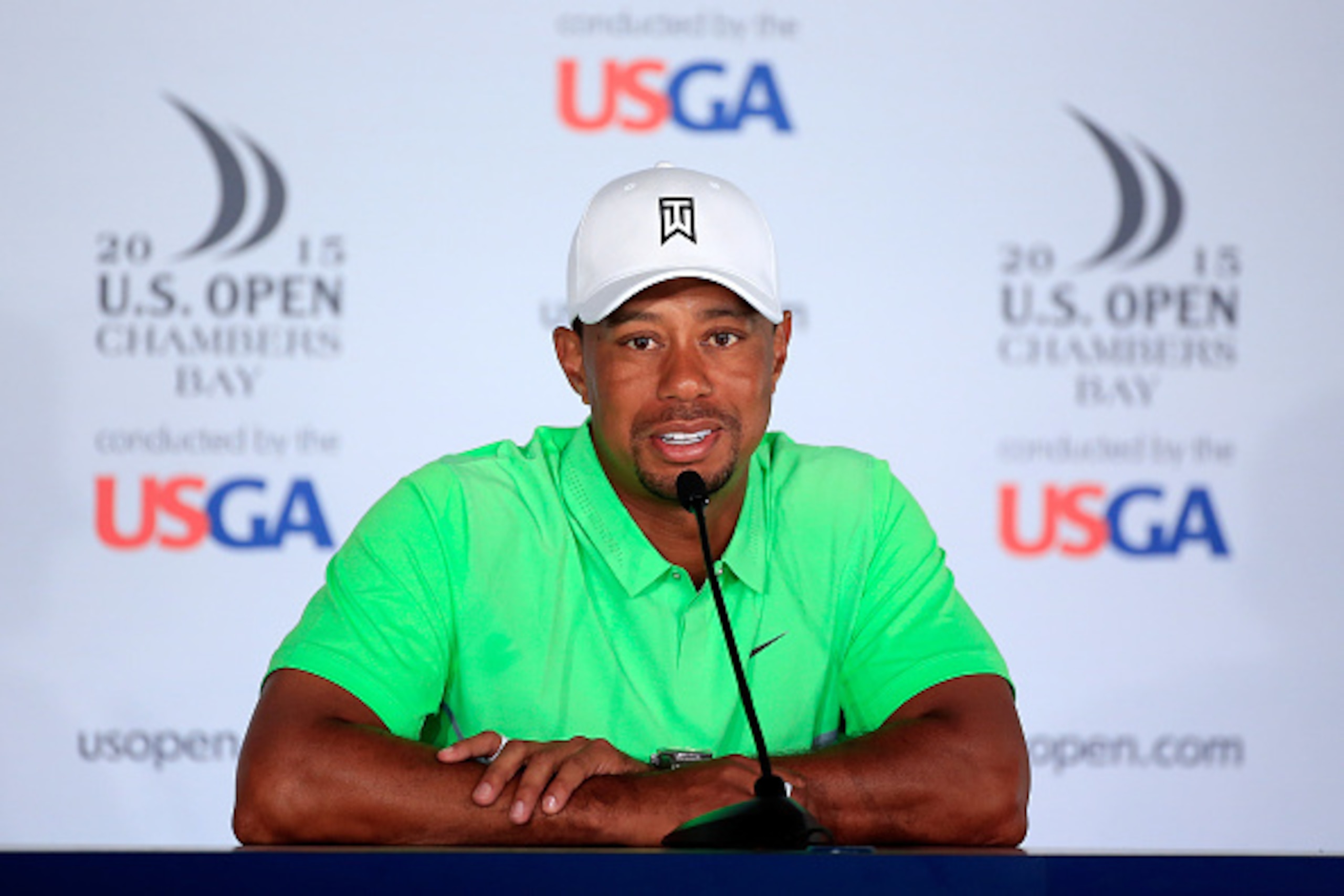 UNIVERSITY PLACE, WA - JUNE 16:  Tiger Woods of the United States speaks to the media during a press conference prior to the start of the 115th U.S. Open Championship at Chambers Bay on June 16, 2015 in University Place, Washington.  (Photo by David Canno