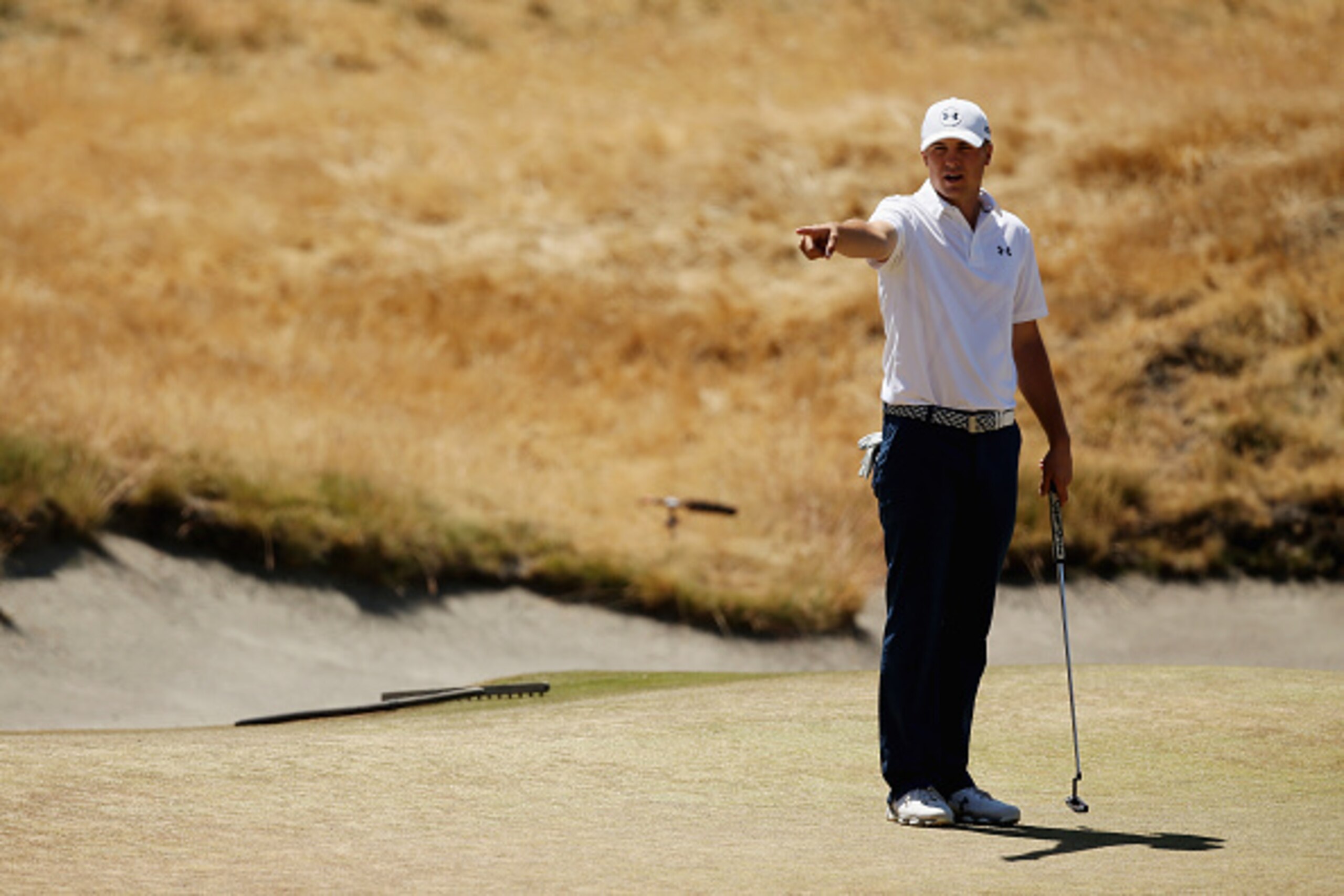 UNIVERSITY PLACE, WA - JUNE 17:  Jordan Spieth of the United States looks over a green during a practice round prior to the start of the 115th U.S. Open Championship at Chambers Bay on June 17, 2015 in University Place, Washington.  (Photo by Mike Ehrmann