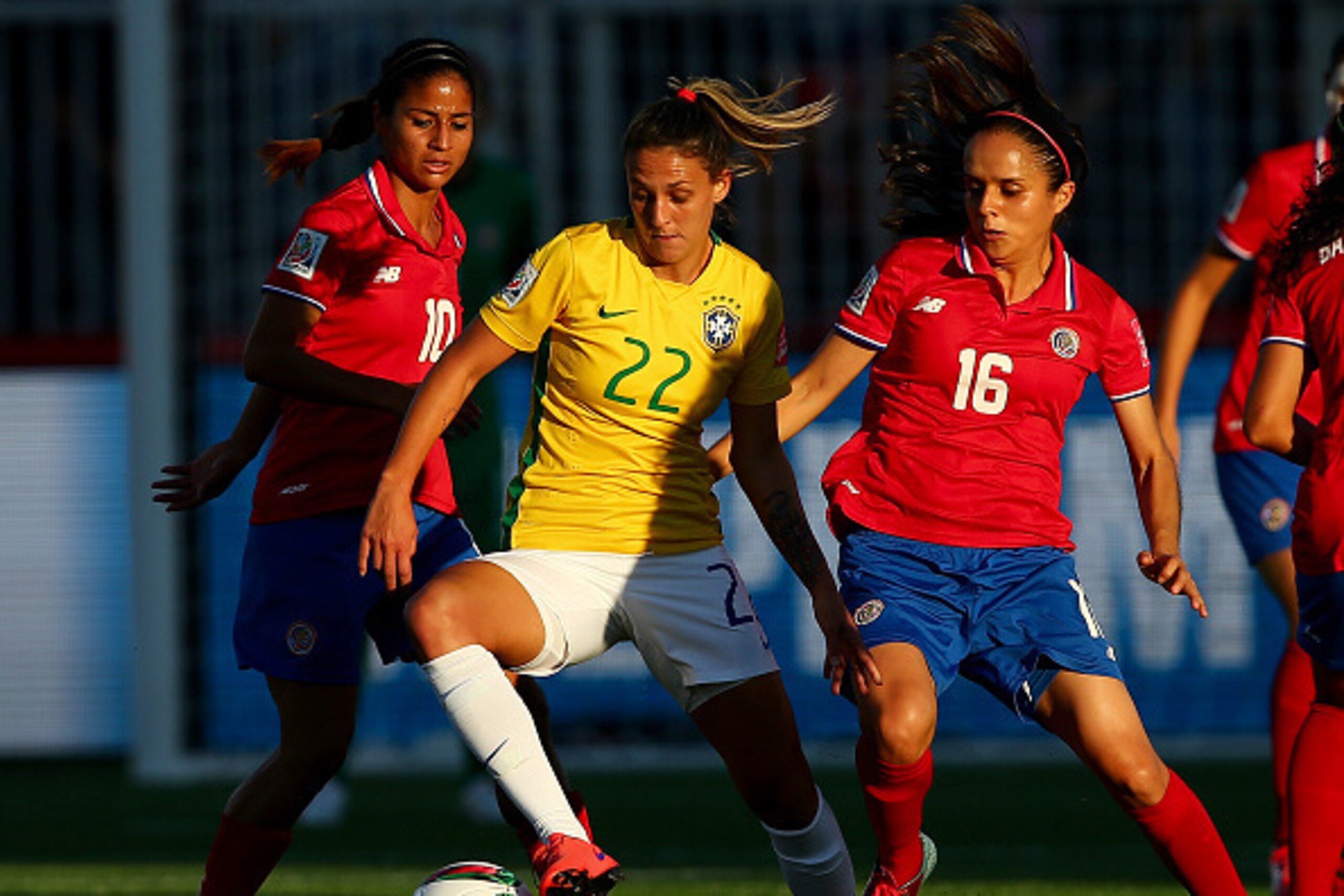 MONCTON, NB - JUNE 17:  Darlene #22 of Brazil fights for the ball against Shirley Cruz #10 and Katherine Alvarado #16 of Costa Rica in the first half during the FIFA Women's World Cup 2015 Group E match at Moncton Stadium on June 17, 2015 in Moncton, Cana