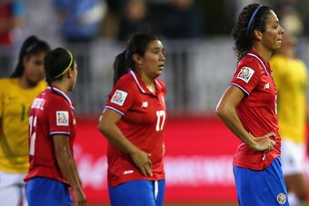 MONCTON, NB - JUNE 17:  Carol Sanchez #6 of Costa Rica and her teammates Karla Villalobos #17 and Lixy Rodriguez #12 react to the loss to Brazil during the FIFA Women's World Cup 2015 Group E match at Moncton Stadium on June 17, 2015 in Moncton, Canada.Br