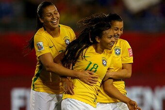 MONCTON, NB - JUNE 17:  Raquel #18 of Brazil celebrates her goal with teamamtes Beatriz #7 and Erika #4 in the second half against Costa Rica during the FIFA Women's World Cup 2015 Group E match at Moncton Stadium on June 17, 2015 in Moncton, Canada.  (Ph