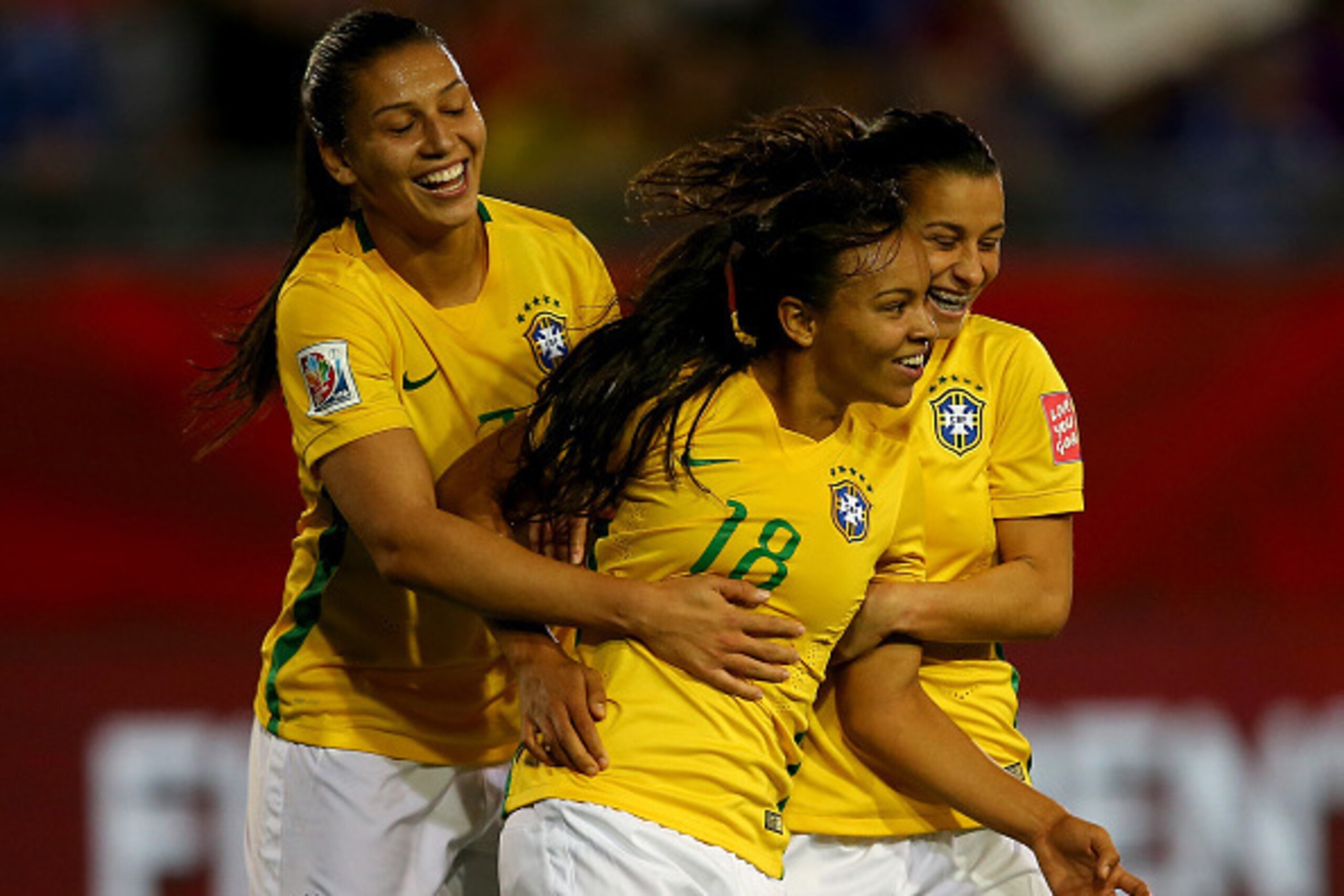MONCTON, NB - JUNE 17:  Raquel #18 of Brazil celebrates her goal with teamamtes Beatriz #7 and Erika #4 in the second half against Costa Rica during the FIFA Women's World Cup 2015 Group E match at Moncton Stadium on June 17, 2015 in Moncton, Canada.  (Ph