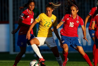 MONCTON, NB - JUNE 17:  Darlene #22 of Brazil fights for the ball against Shirley Cruz #10 and Katherine Alvarado #16 of Costa Rica in the first half during the FIFA Women's World Cup 2015 Group E match at Moncton Stadium on June 17, 2015 in Moncton, Cana