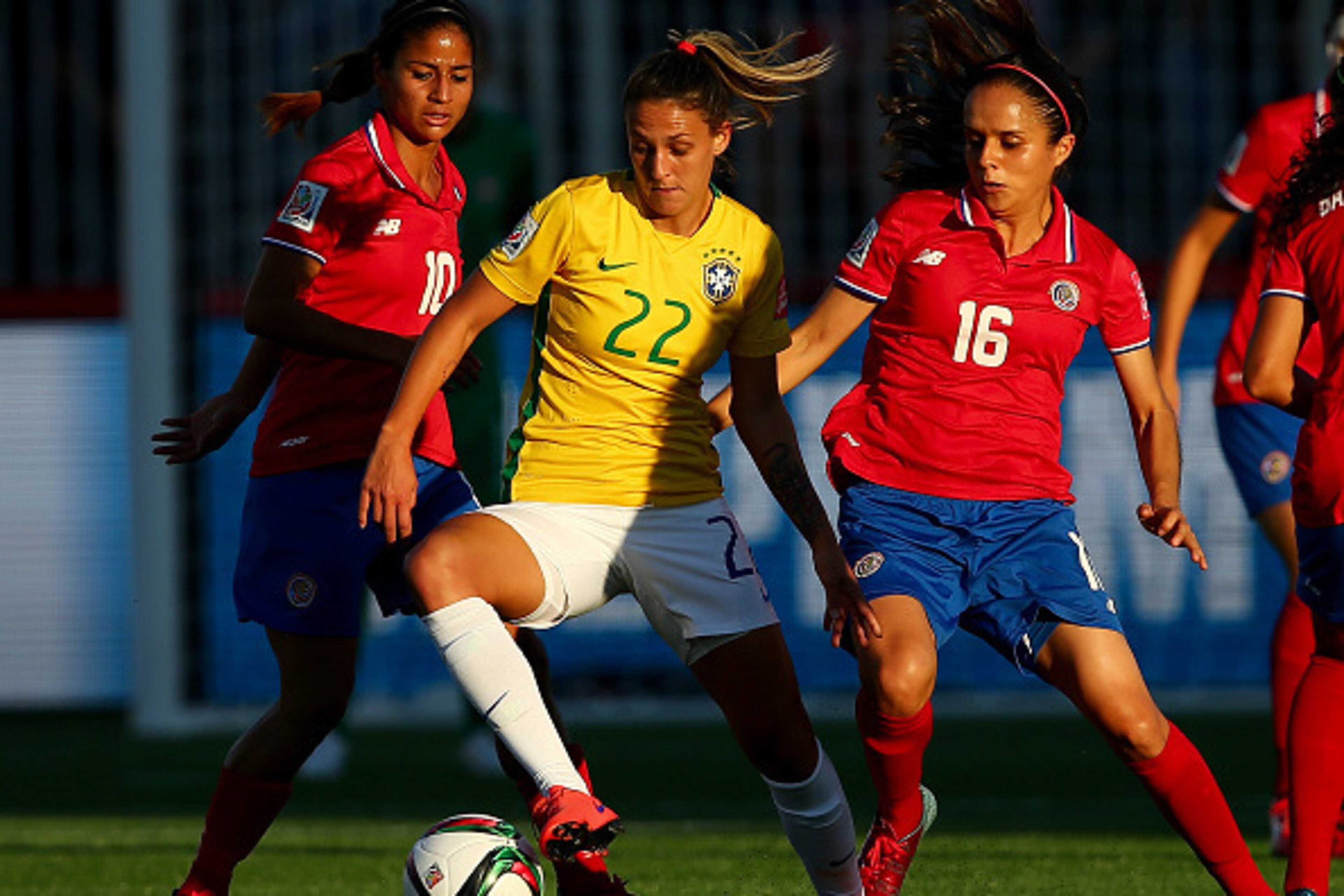 MONCTON, NB - JUNE 17:  Darlene #22 of Brazil fights for the ball against Shirley Cruz #10 and Katherine Alvarado #16 of Costa Rica in the first half during the FIFA Women's World Cup 2015 Group E match at Moncton Stadium on June 17, 2015 in Moncton, Cana