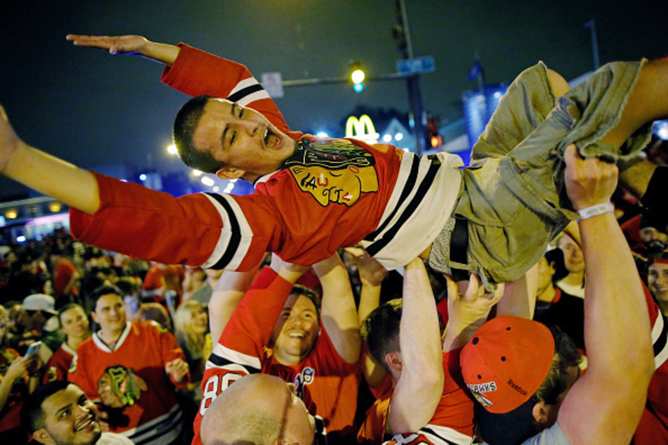 CHICAGO, IL - JUNE 15:  Fans celebrate the Chicago Blackhawks winning the 2015 Stanley Cup outside of Wrigley Field on June 15, 2015 in Chicago, Illinois.  (Photo by Jon Durr/Getty Images)