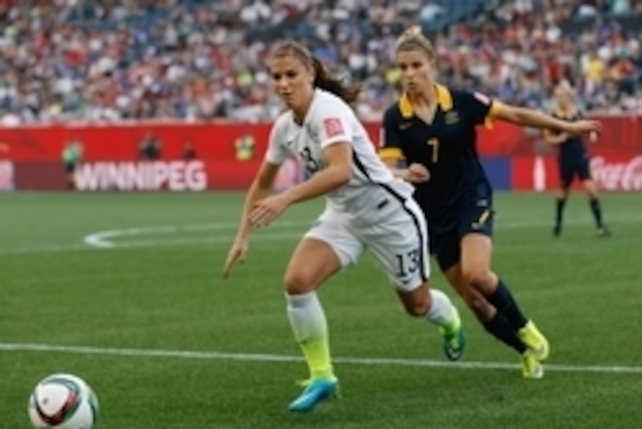 Jun 8, 2015; Winnipeg, Manitoba, CAN; United States forward Alex Morgan (13) is pursued by Australia defender Steph Catley (7) in a Group D soccer match in the 2015 women's World Cup at Winnipeg Stadium. U.S. won 3-1. Mandatory Credit: USA TODAY Sports Im Jun 8, 2015; Winnipeg, Manitoba, CAN; United States forward Alex Morgan (13) is pursued by Australia defender Steph Catley (7) in a Group D soccer match in the 2015 women's World Cup at Winnipeg Stadium. U.S. won 3-1. Mandatory Credit: USA TODAY Sports Im