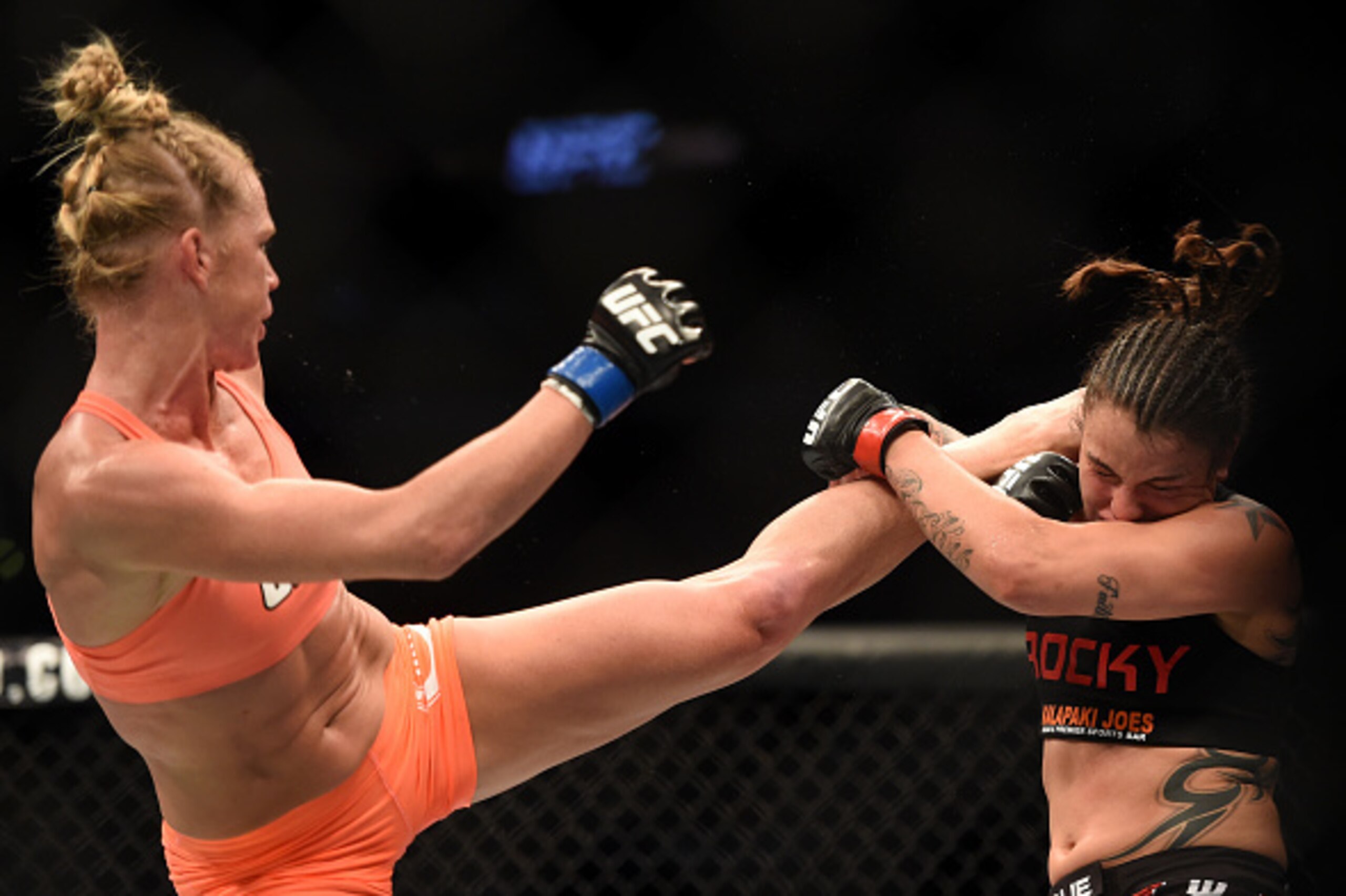 LOS ANGELES, CA - FEBRUARY 28:  (L) Holly Holm kicks Raquel Pennington in their women's bantamweight bout during the UFC 184 event at Staples Center on February 28, 2015 in Los Angeles, California.  (Photo by Harry How/Getty Images)