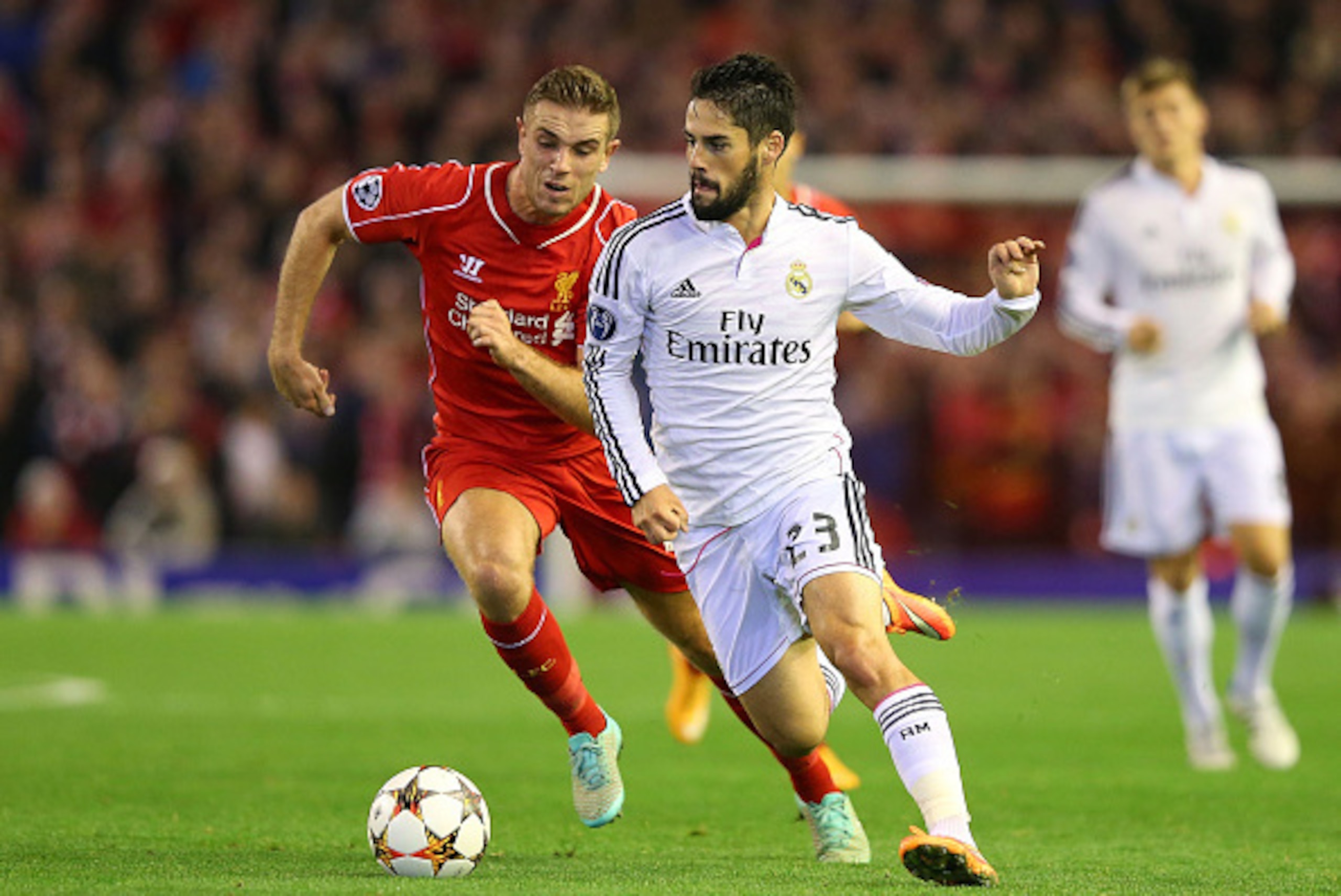 LIVERPOOL, ENGLAND - OCTOBER 22:  Isco of Real Madrid competes with Jordan Henderson of Liverpool during the UEFA Champions League Group B match between Liverpool and Real Madrid CF on October 22, 2014 in Liverpool, United Kingdom.  (Photo by Alex Livesey