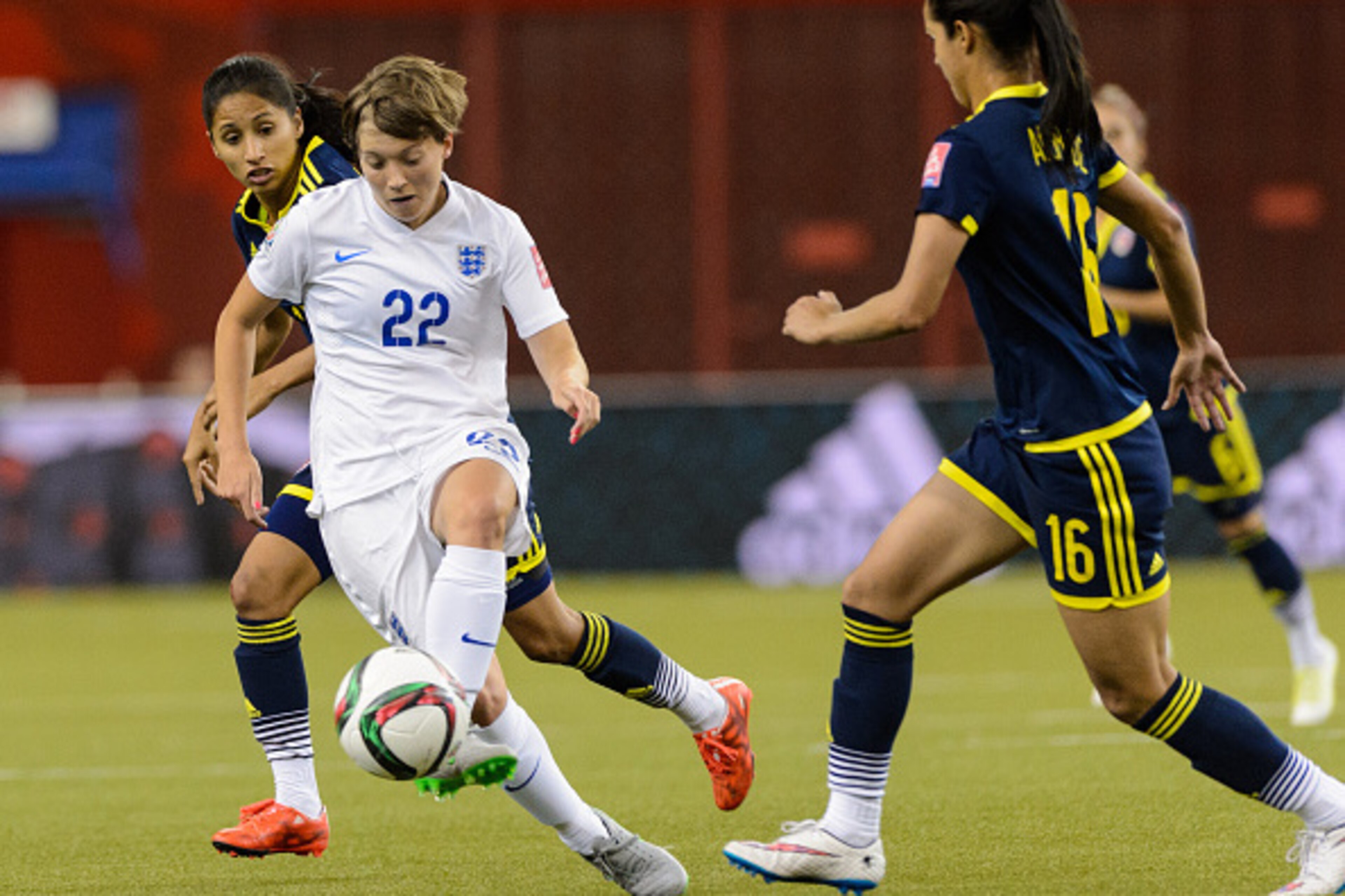 MONTREAL, QC - JUNE 17:  Fran Kirby #22 of England tries to move the ball past Lady Andrade #16 of Colombia during the 2015 FIFA Women's World Cup Group F match at Olympic Stadium on June 17, 2015 in Montreal, Quebec, Canada.  (Photo by Minas Panagiotakis
