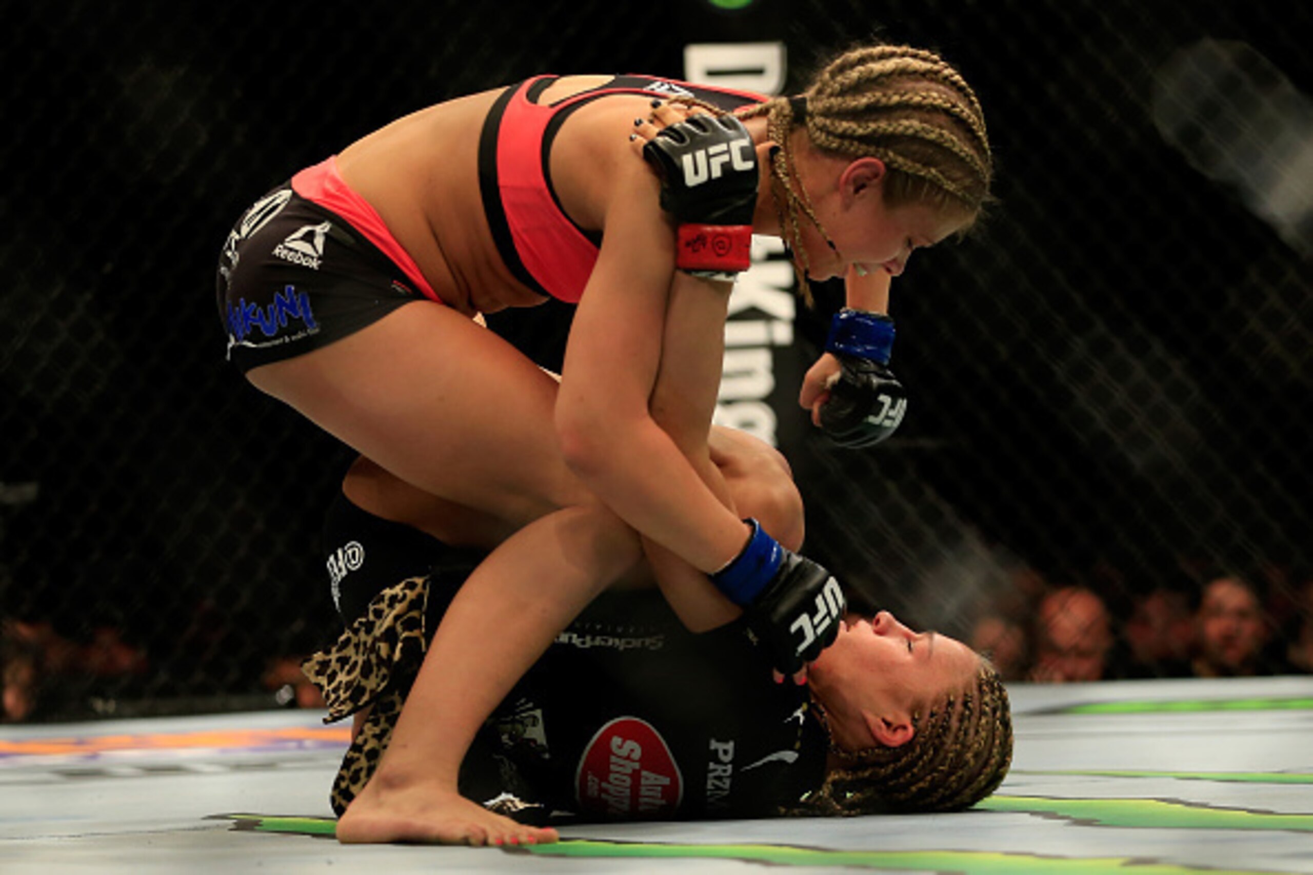 NEWARK, NJ - APRIL 18:  Felice Herrig (black top) and Paige VanZant (pink top) fight in their women's strawweight bout during the UFC Fight Night event at Prudential Center on April 18, 2015 in Newark, New Jersey.  (Photo by Alex Trautwig/Getty Images)