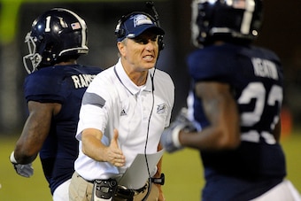STATESBORO, GA - SEPTEMBER 25:   Head coach Willie Fritz of the Georgia Southern Eagles congratulates his players after a touchdown against the Appalachian State Mountaineers during the fourth quarter on September 25, 2014 at Paulson Stadium in Statesboro