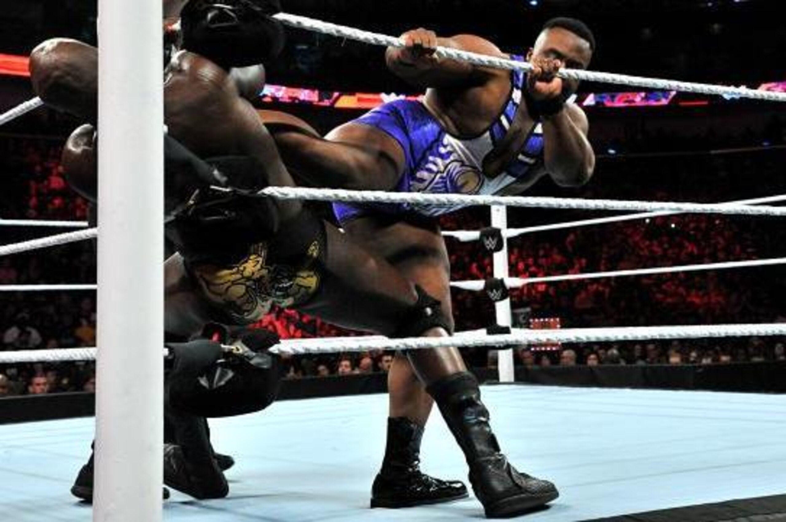 Big E attacks Titus O'Neil. Big E attacks Titus O'Neil.