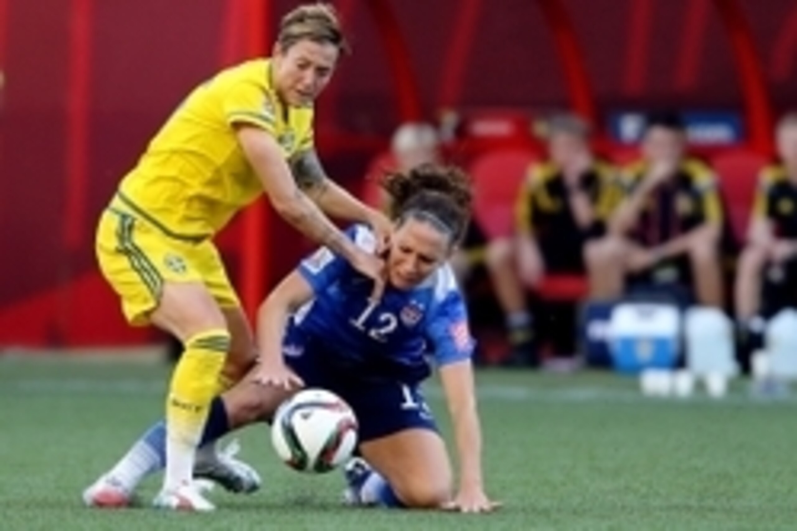 Jun 12, 2015; Winnipeg, Manitoba, CAN; United States midfielder Lauren Holiday (12) and Sweden midfielder Terese Sjogran (15) battle for the ball during the first half in a Group D soccer match in the 2015 FIFA women's World Cup at Winnipeg Stadium. Manda