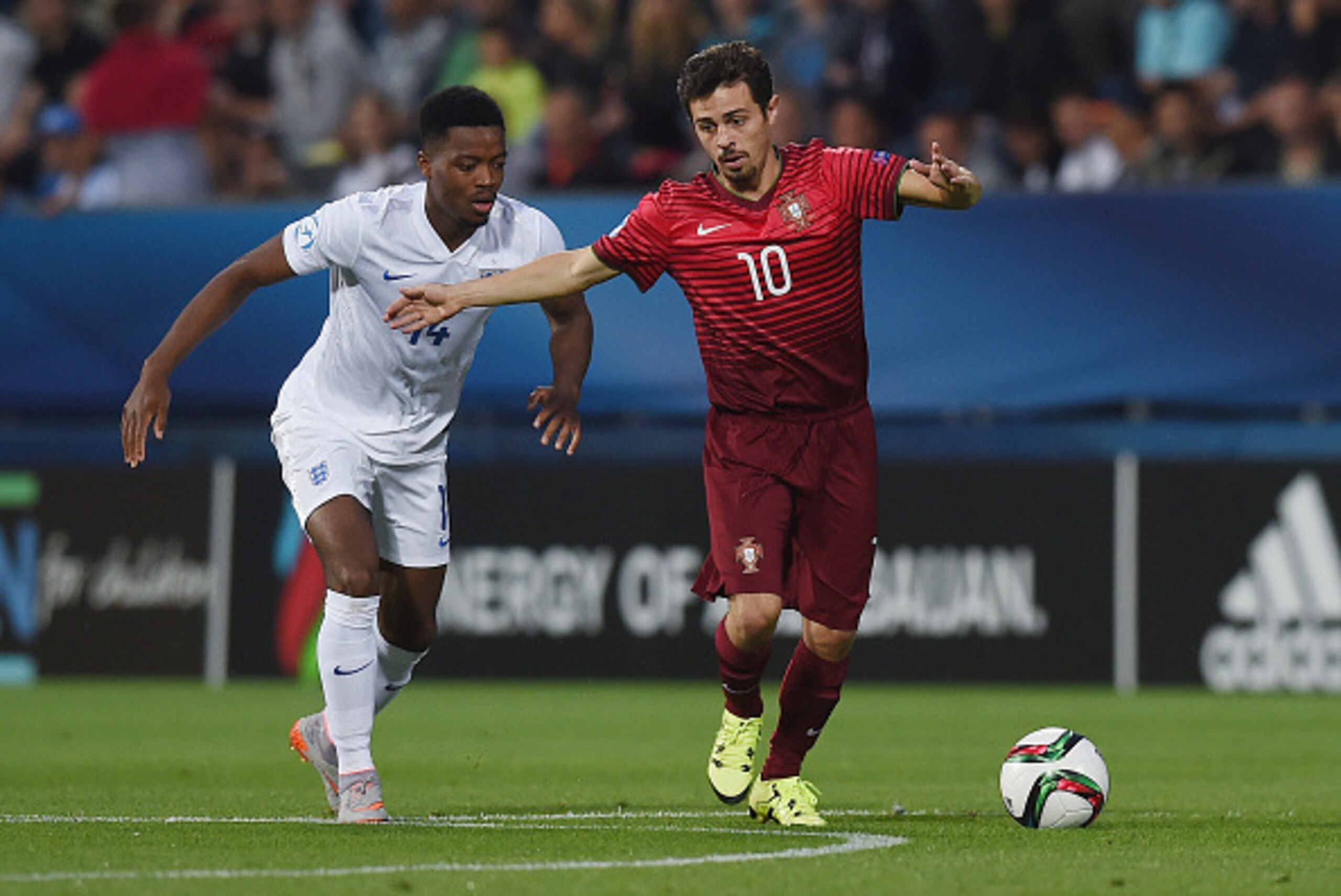 UHERSKE HRADISTE, CZECH REPUBLIC - JUNE 18: Nathaniel Chalobah of England in action with Bernardo Silva of Portugal during the UEFA Under21 European Championship 2015 Group B match between England and Portugal at Mestsky Fotbalovy Stadium on June 18, 2015