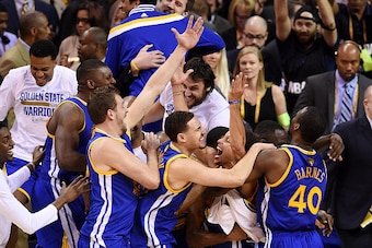 CLEVELAND, OH - JUNE 16:  Stephen Curry #30 and the Golden State Warriors celebrate their 105 to 97 win over the Cleveland Cavaliers in Game Six of the 2015 NBA Finals at Quicken Loans Arena on June 16, 2015 in Cleveland, Ohio. NOTE TO USER: User expressl