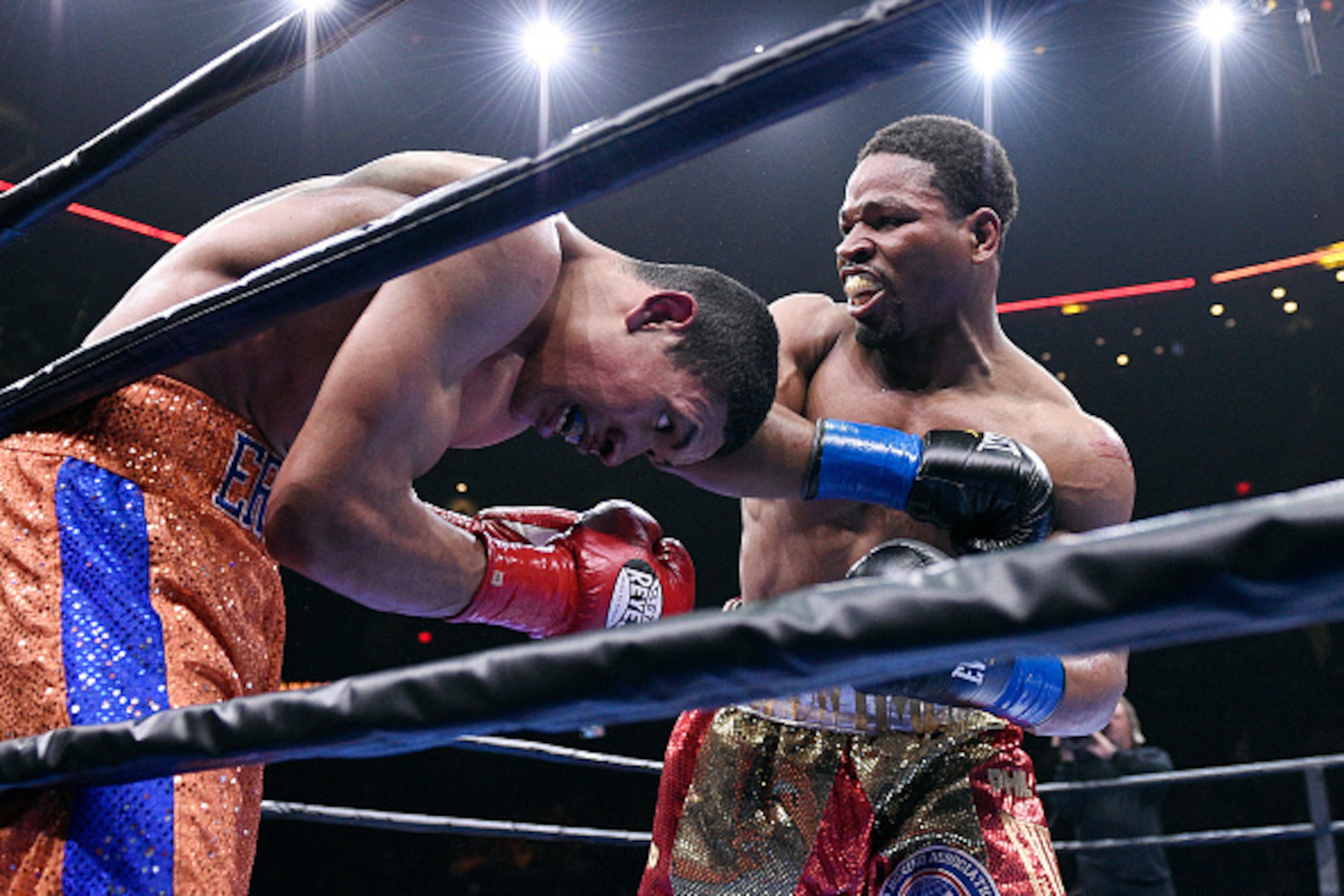 ONTARIO, CA - MARCH 13:  Shawn Porter (R) throws a punch against Erick Bone during their 12 round welterweight bout at Citizens Business Bank Arena March 13, 2015 in Ontario, California. (Photo by Kevork Djansezian/Getty Images)
