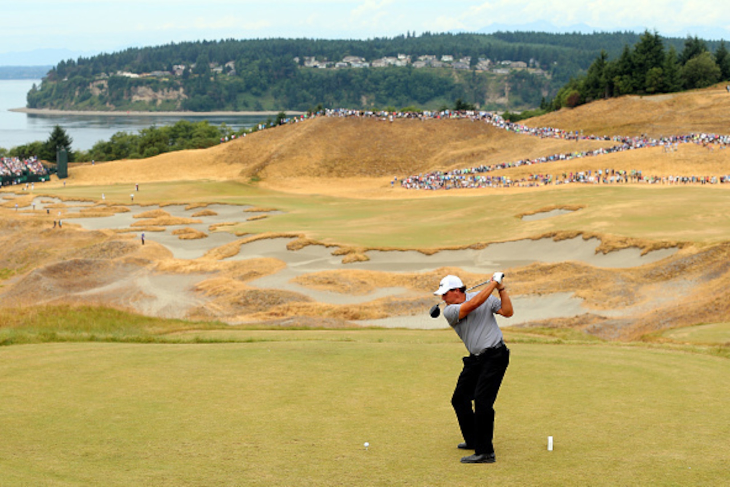 UNIVERSITY PLACE, WA - JUNE 18:  Phil Mickelson of the United States hits his tee shot on the the 14th hole during the first round of the 115th U.S. Open Championship at Chambers Bay on June 18, 2015 in University Place, Washington.  (Photo by Andrew Redi