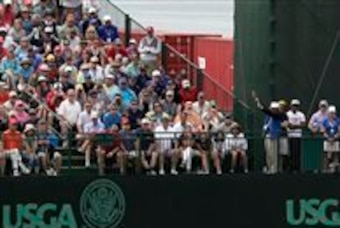 Phil Mickelson putts at the 17th green. Phil Mickelson putts at the 17th green.
