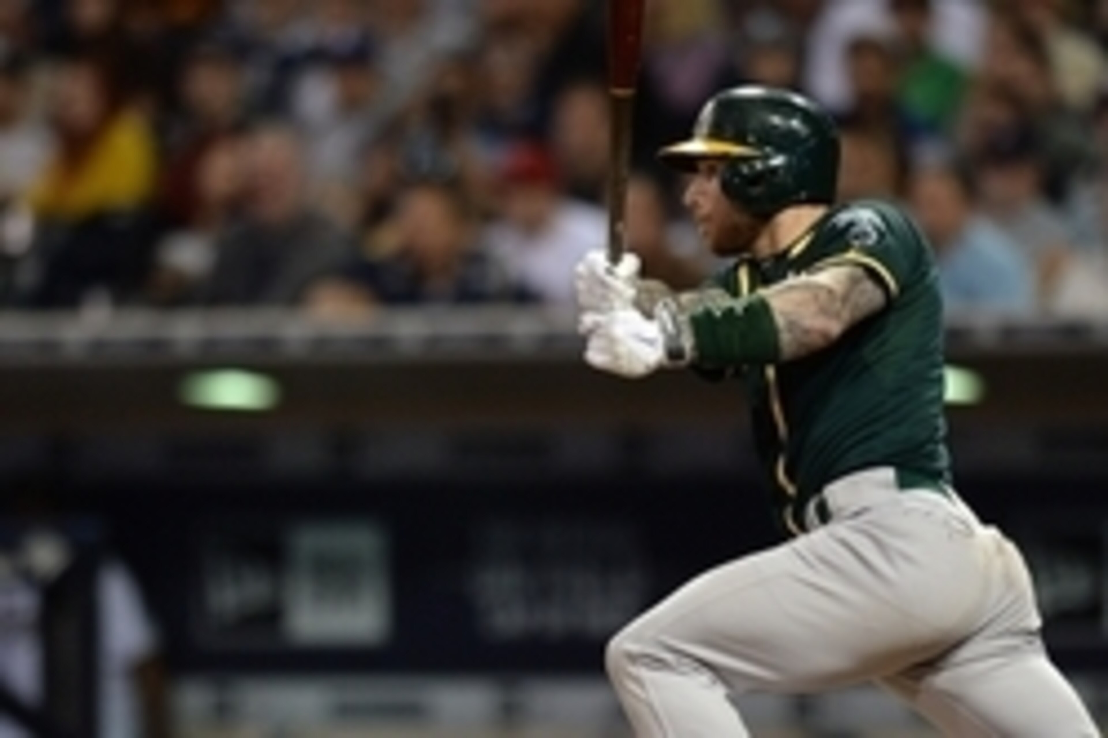 Jun 15, 2015; San Diego, CA, USA; Oakland Athletics third baseman Brett Lawrie (15) hits an RBI single during the fifth inning against the San Diego Padres at Petco Park. Mandatory Credit: Jake Roth-USA TODAY Sports Jun 15, 2015; San Diego, CA, USA; Oakland Athletics third baseman Brett Lawrie (15) hits an RBI single during the fifth inning against the San Diego Padres at Petco Park. Mandatory Credit: Jake Roth-USA TODAY Sports