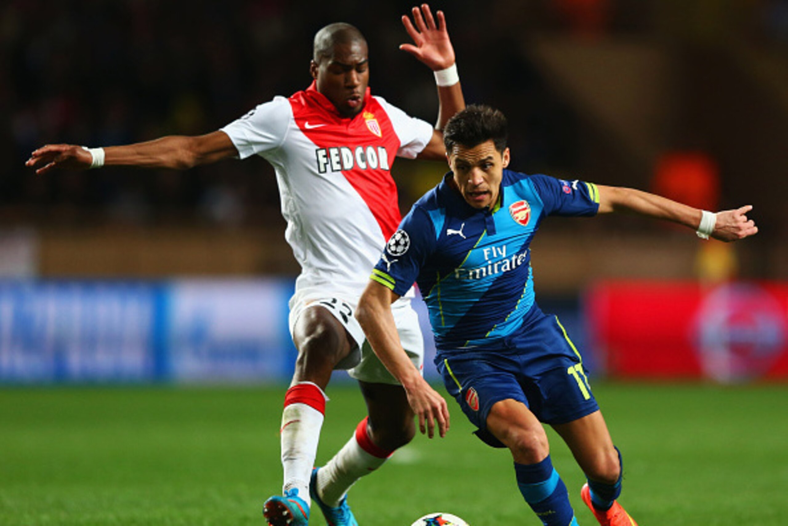 MONACO - MARCH 17:  Alexis Sanchez of Arsenal takes on Geoffrey Kondogbia of Monaco during the UEFA Champions League round of 16 second leg match between AS Monaco and Arsenal at Stade Louis II on March 17, 2015 in Monaco, Monaco.  (Photo by Michael Steel