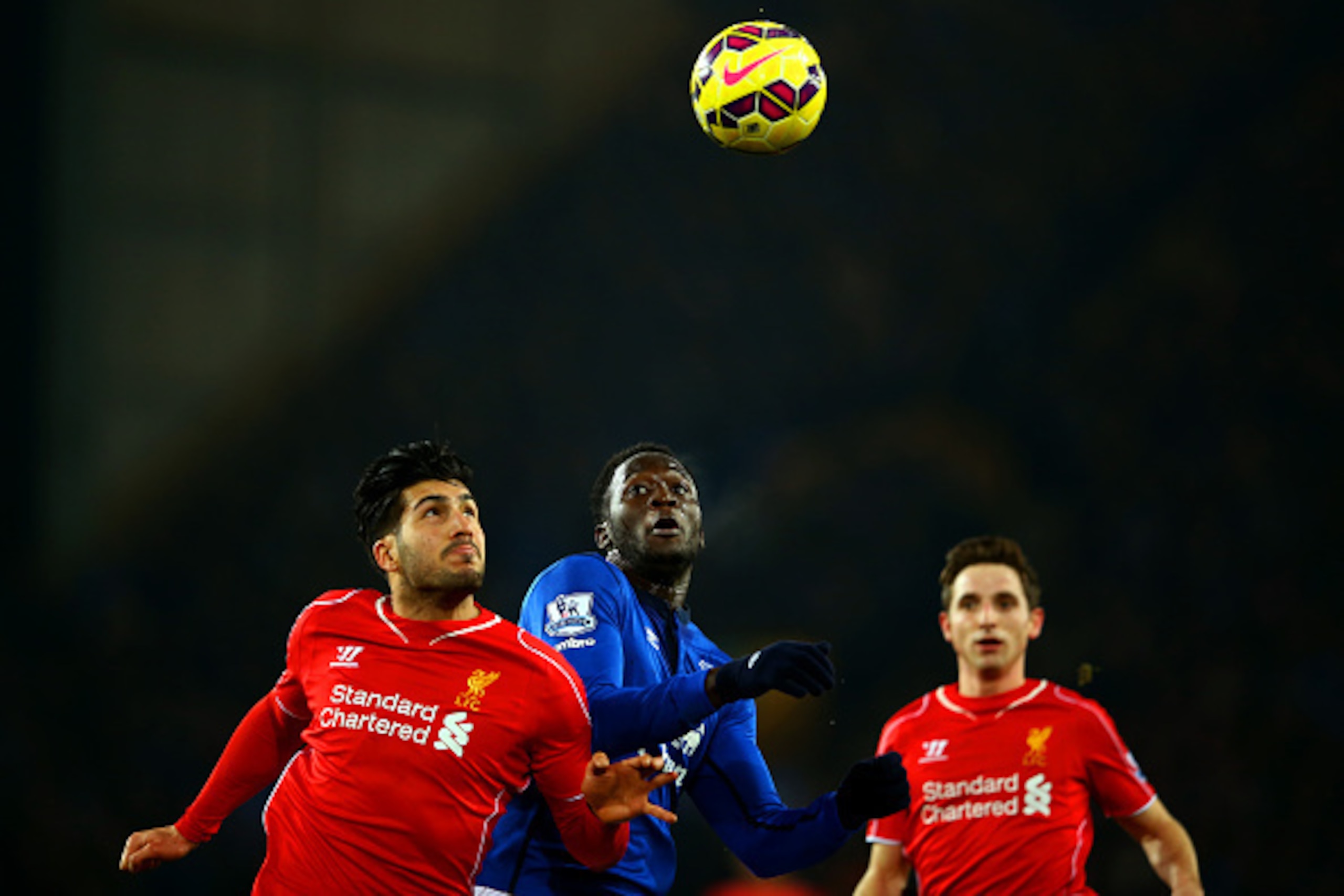 LIVERPOOL, ENGLAND - FEBRUARY 07:  Emre Can of Liverpool jumps for the ball with Romelu Lukaku of Everton during the Barclays Premier League match between Everton and Liverpool at Goodison Park on February 7, 2015 in Liverpool, England.  (Photo by Richard
