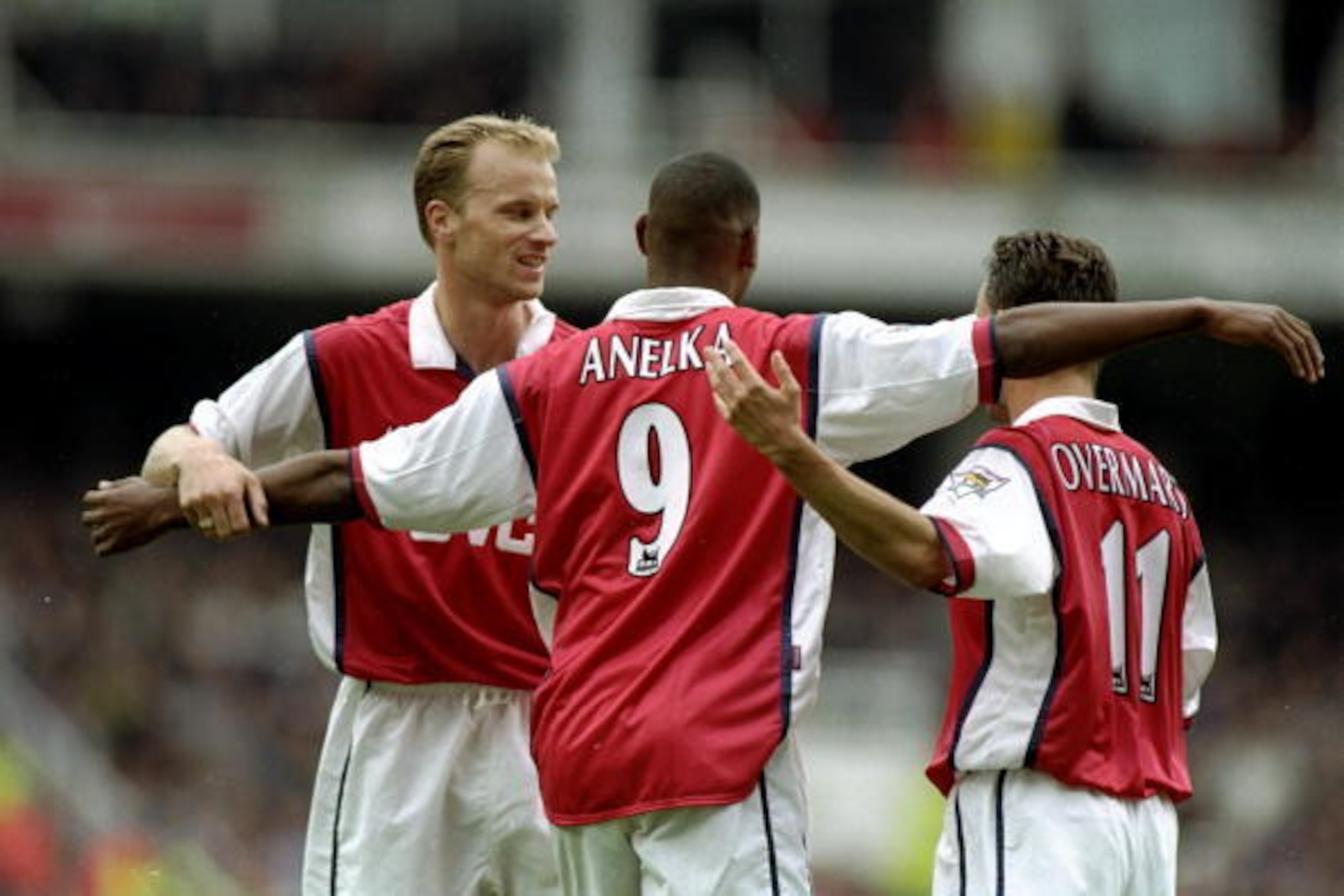 4 Oct 1998:  Nicolas Anelka of Arsenal is congratulated by his team-mates Dennis Bergkamp and Marc Overmars after scoring a goal during the FA Carling Premiership match against Newcastle United played at Highbury in London, England.  The match finished in