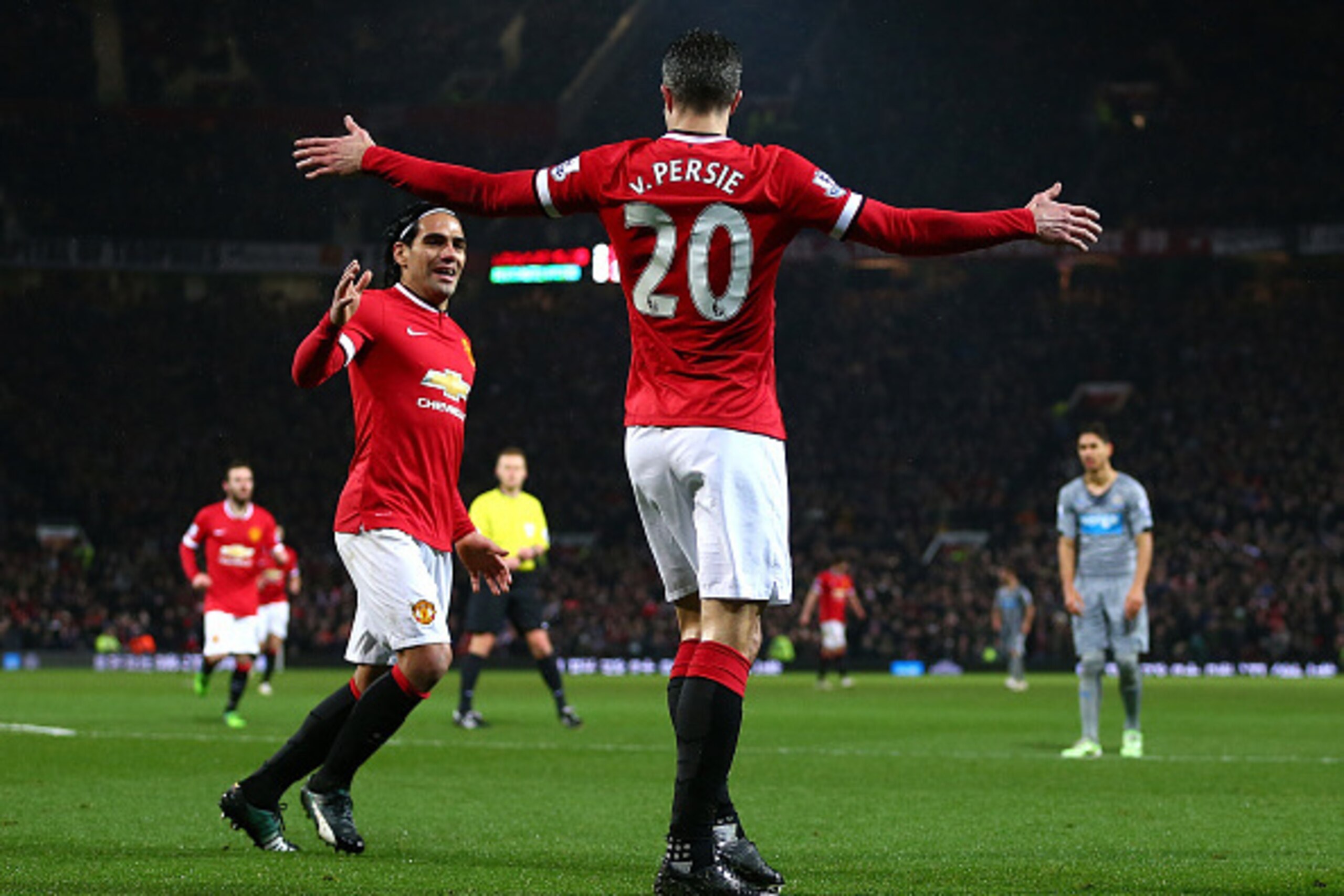 MANCHESTER, ENGLAND - DECEMBER 26: Robin van Persie of Manchester United celebrates scoring the third goal with team-mate Radamel Falcao during the Barclays Premier League match between Manchester United and Newcastle United at Old Trafford on December 2 MANCHESTER, ENGLAND - DECEMBER 26: Robin van Persie of Manchester United celebrates scoring the third goal with team-mate Radamel Falcao during the Barclays Premier League match between Manchester United and Newcastle United at Old Trafford on December 2