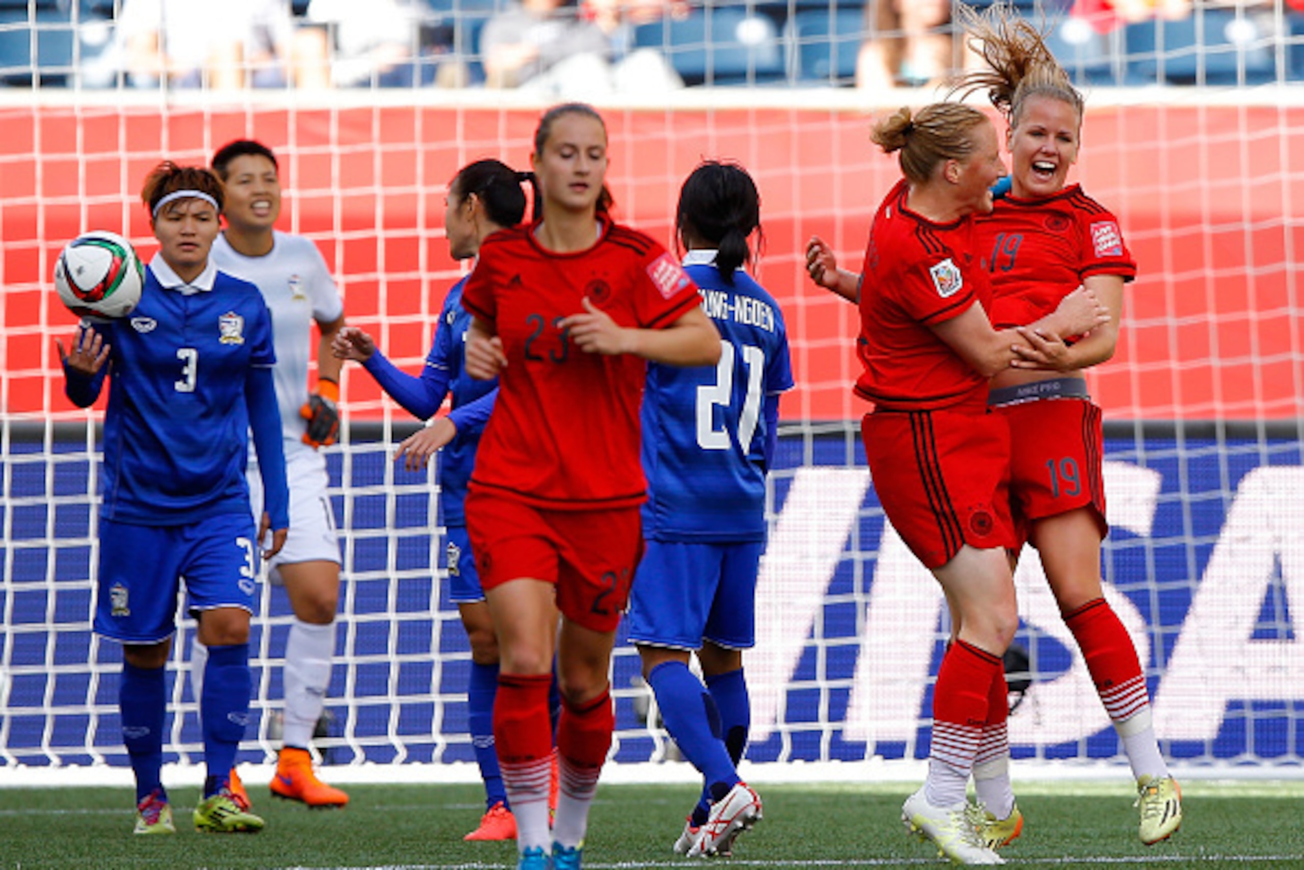 WINNIPEG, MB - JUNE 15:  Lena Petermann #19 of Germany celebrates her second goal against Thailand with Melanie Behringer #7 during the FIFA Women's World Cup Canada 2015 match between Thailand and Germany at Winnipeg Stadium on June 15, 2015 in Winnipeg,